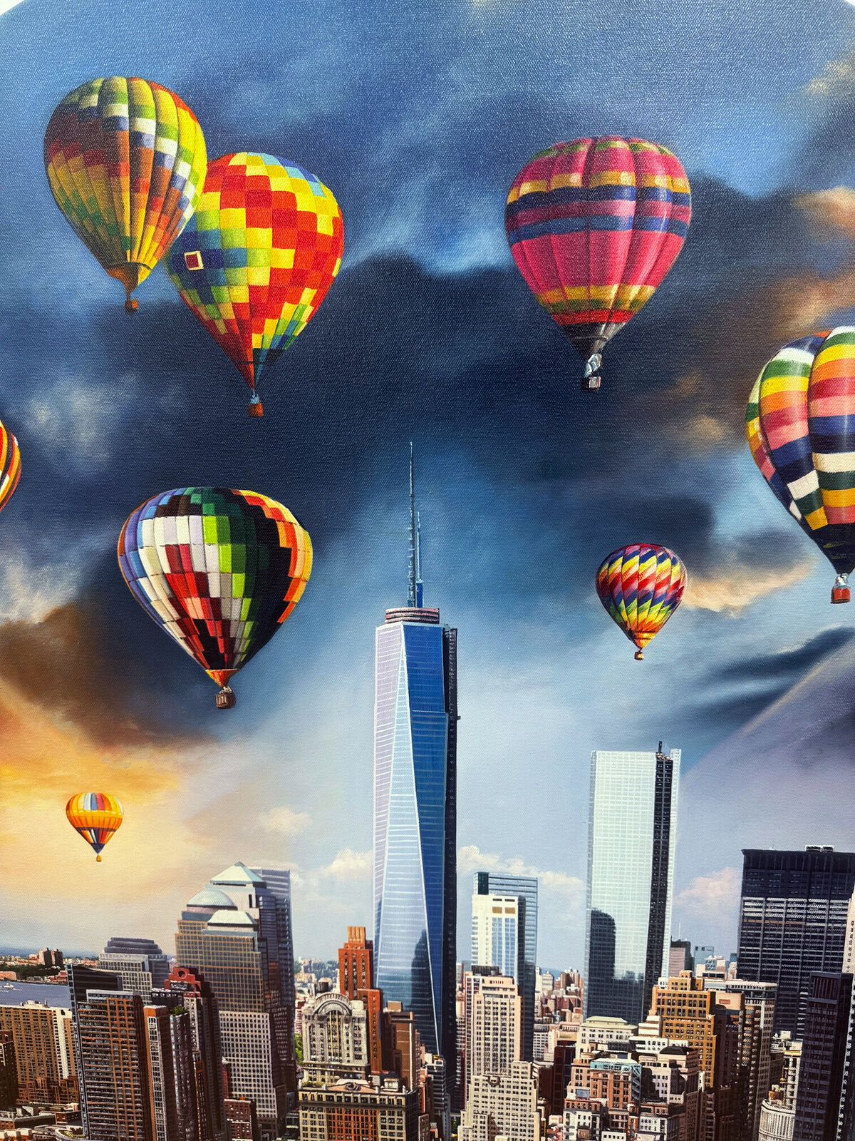 A picture of hot air balloons flying over a city.