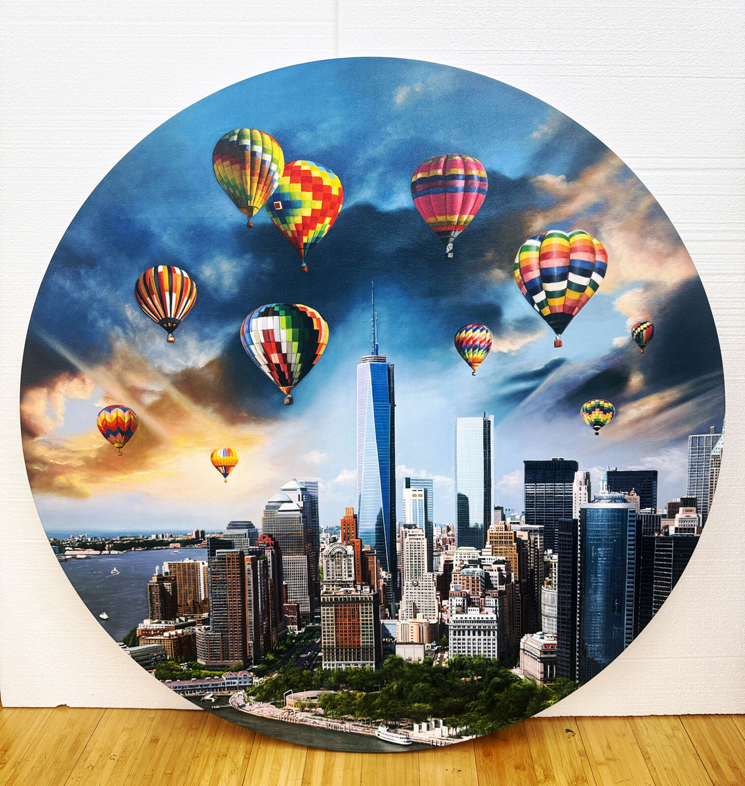 A picture of hot air balloons flying over a city.