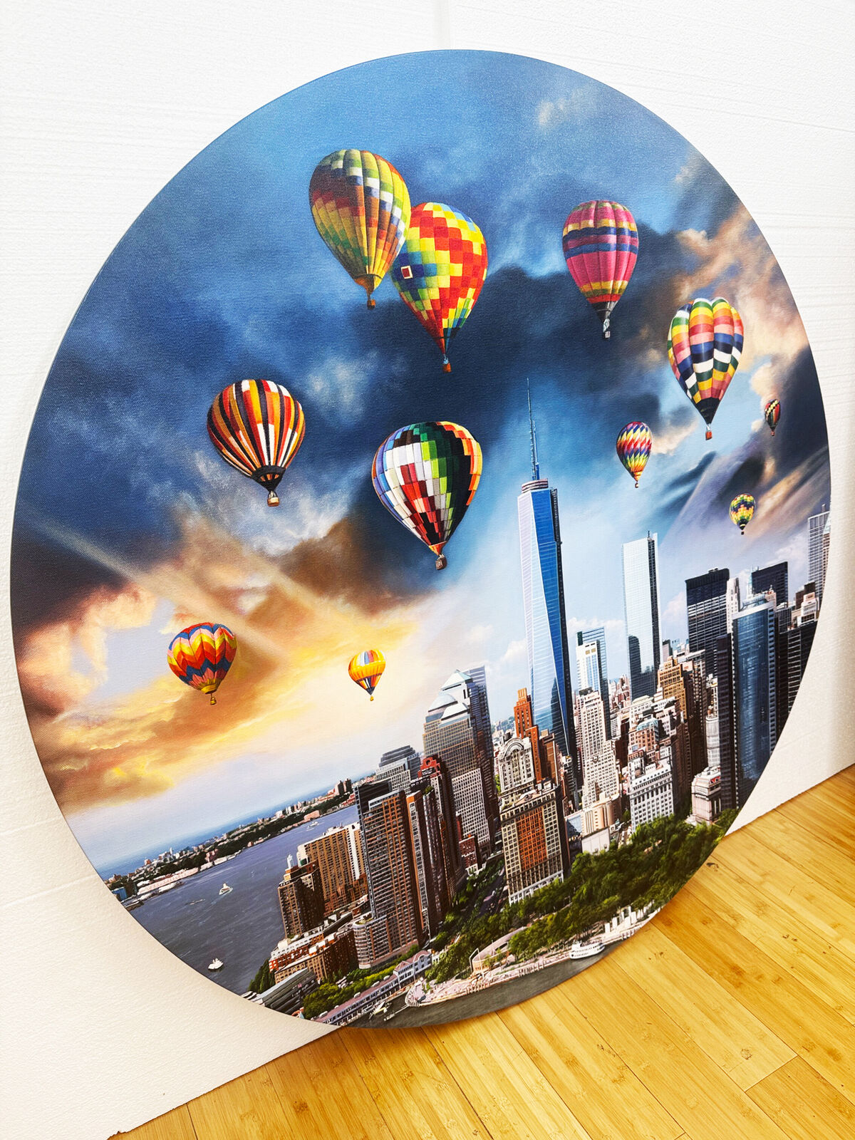 A picture of hot air balloons flying over a city.
