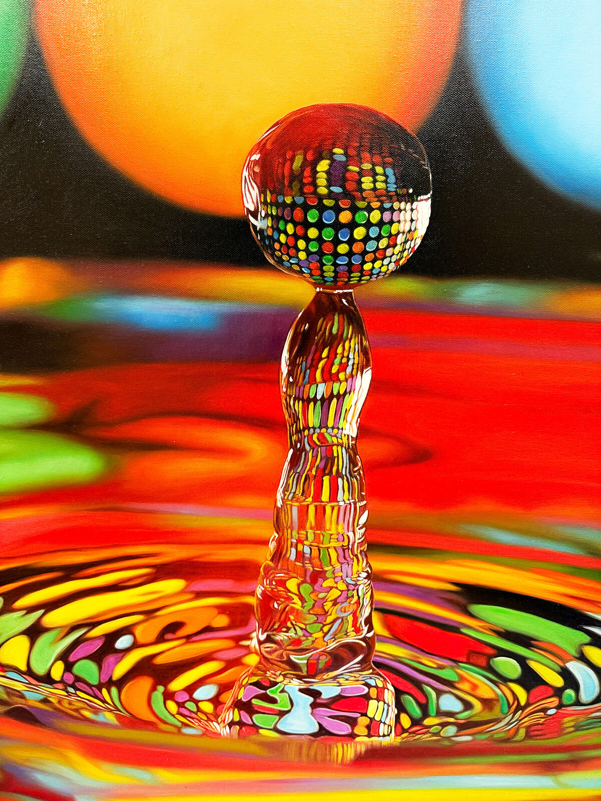 A picture of a drop of water falling into a pool of water.