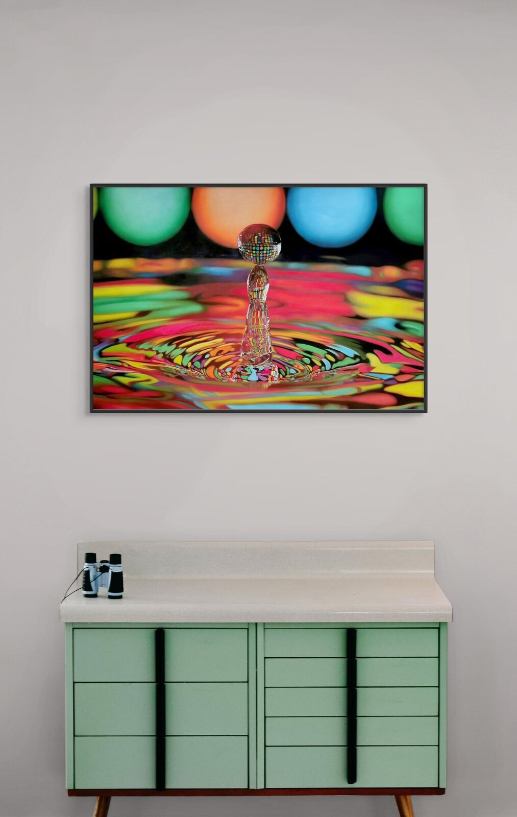 A picture of a drop of water falling into a pool of water.