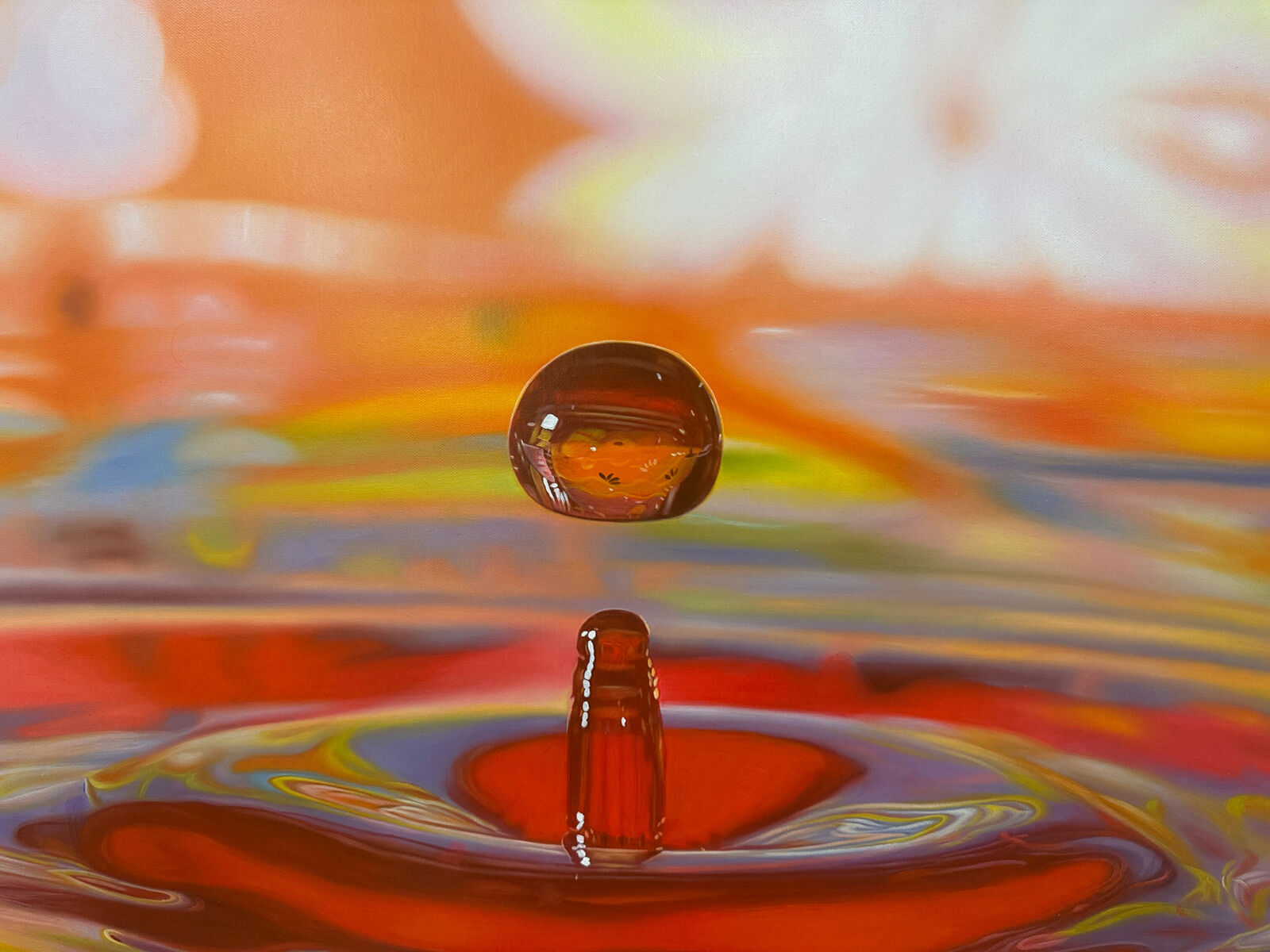 A drop of water falling into a pool of water.