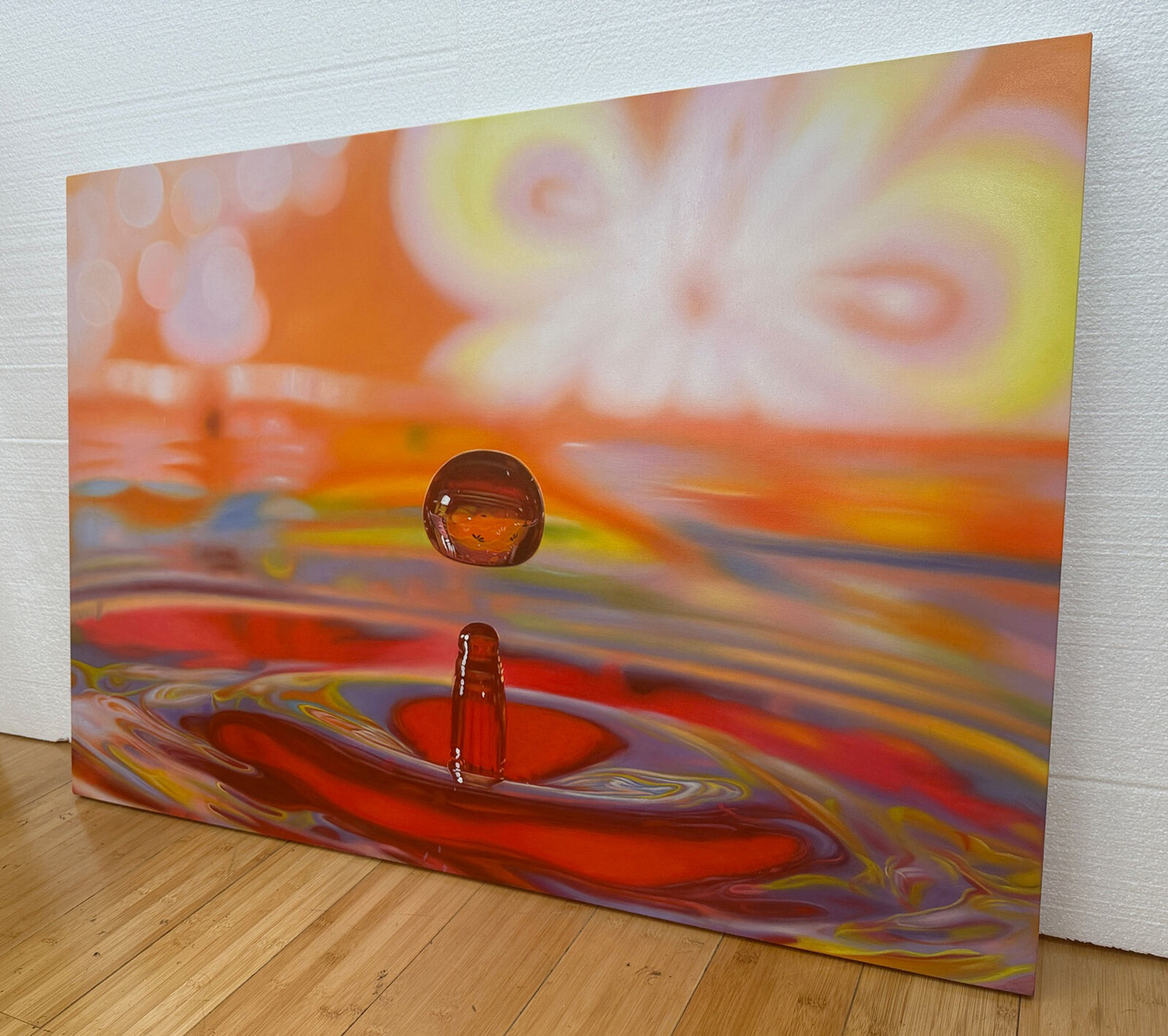 A drop of water falling into a pool of water.