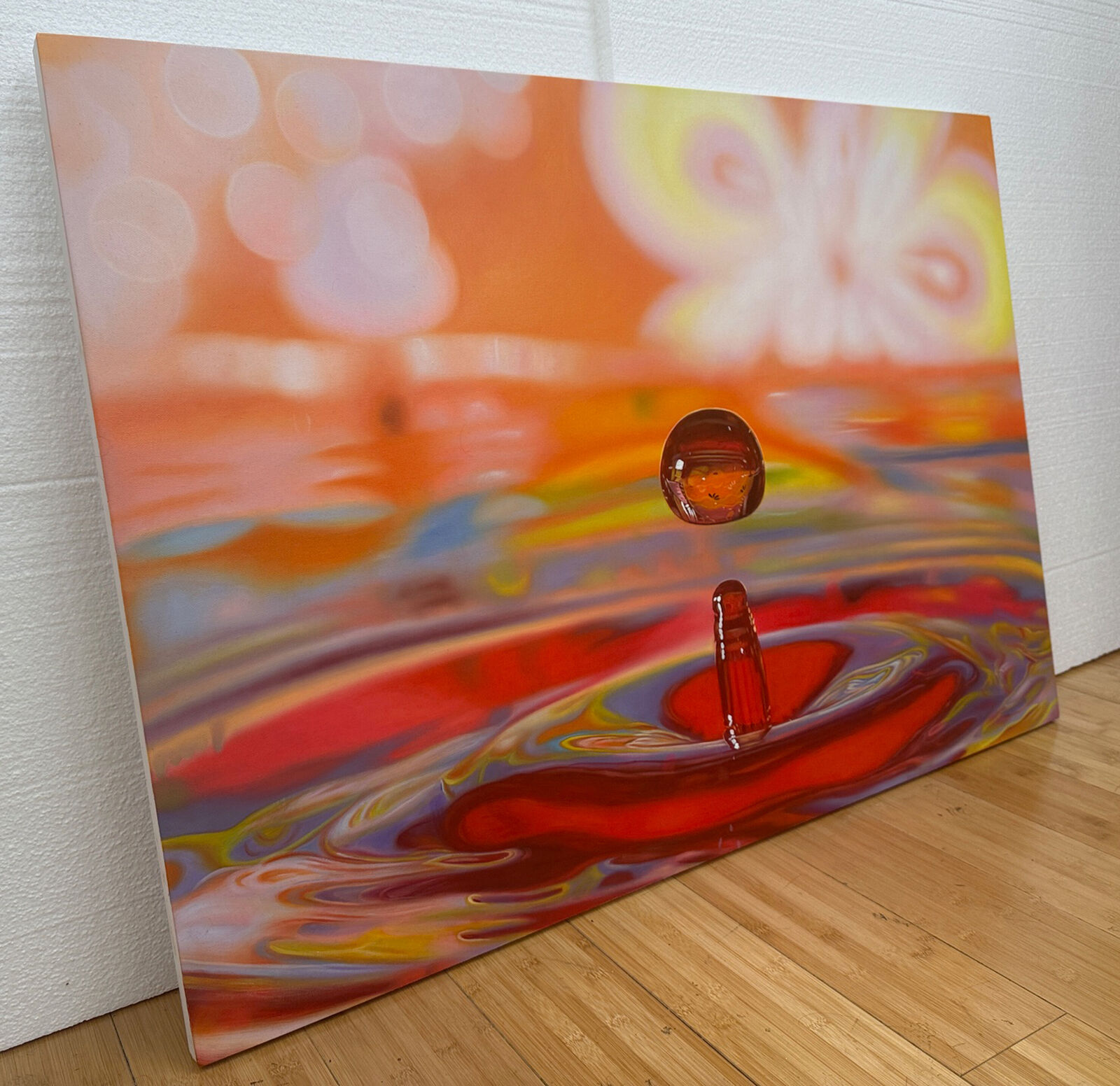 A drop of water falling into a pool of water.