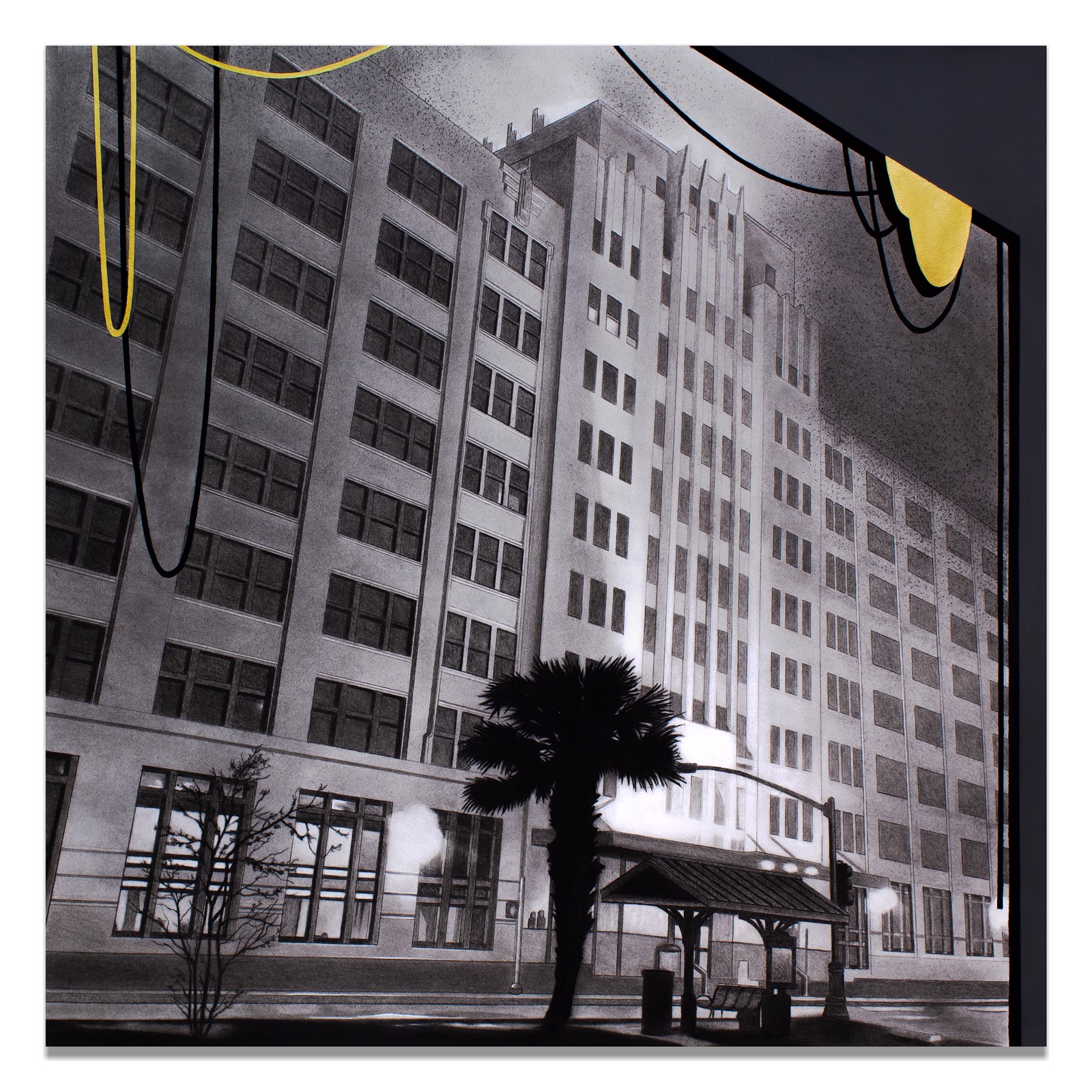 A black and white photo of a tall building with a palm tree.