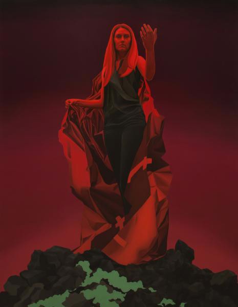 a woman in a red cloak standing on top of a rock