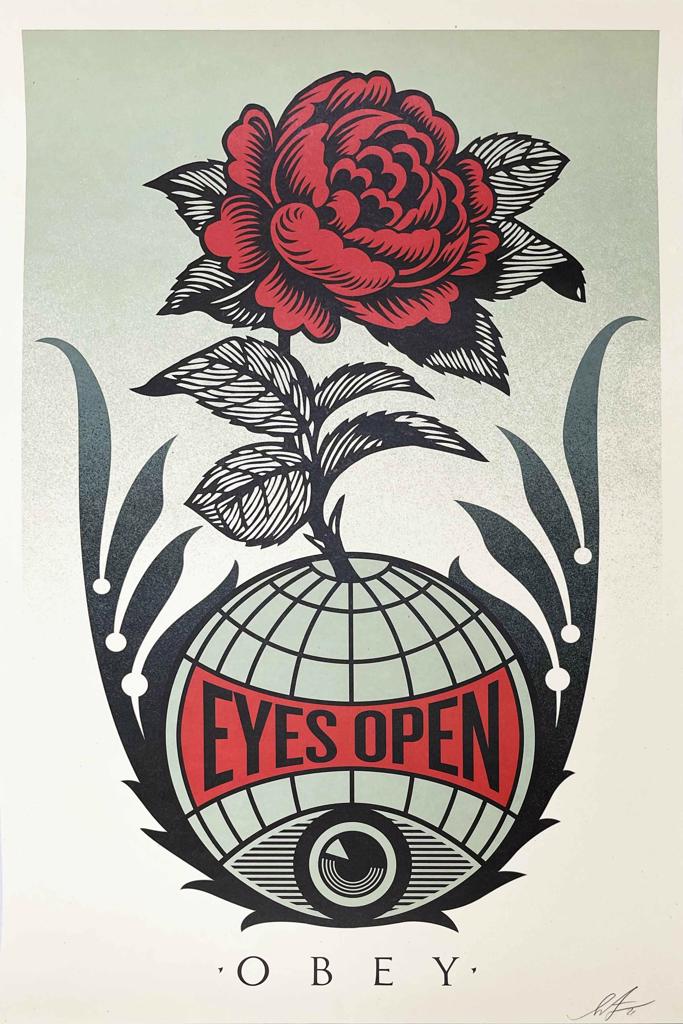 A poster with a red rose and a globe on it.