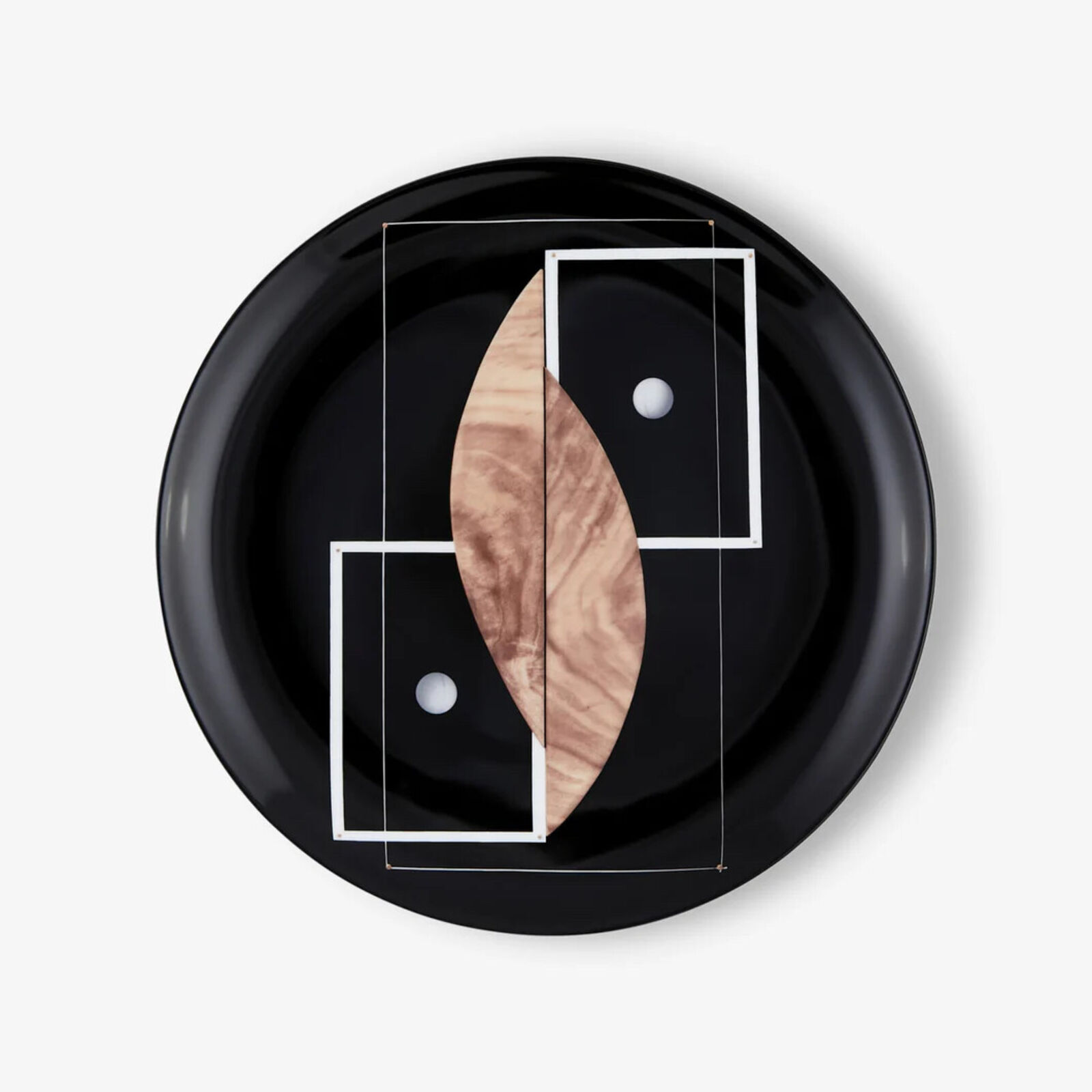 A black plate with a geometric design on it.