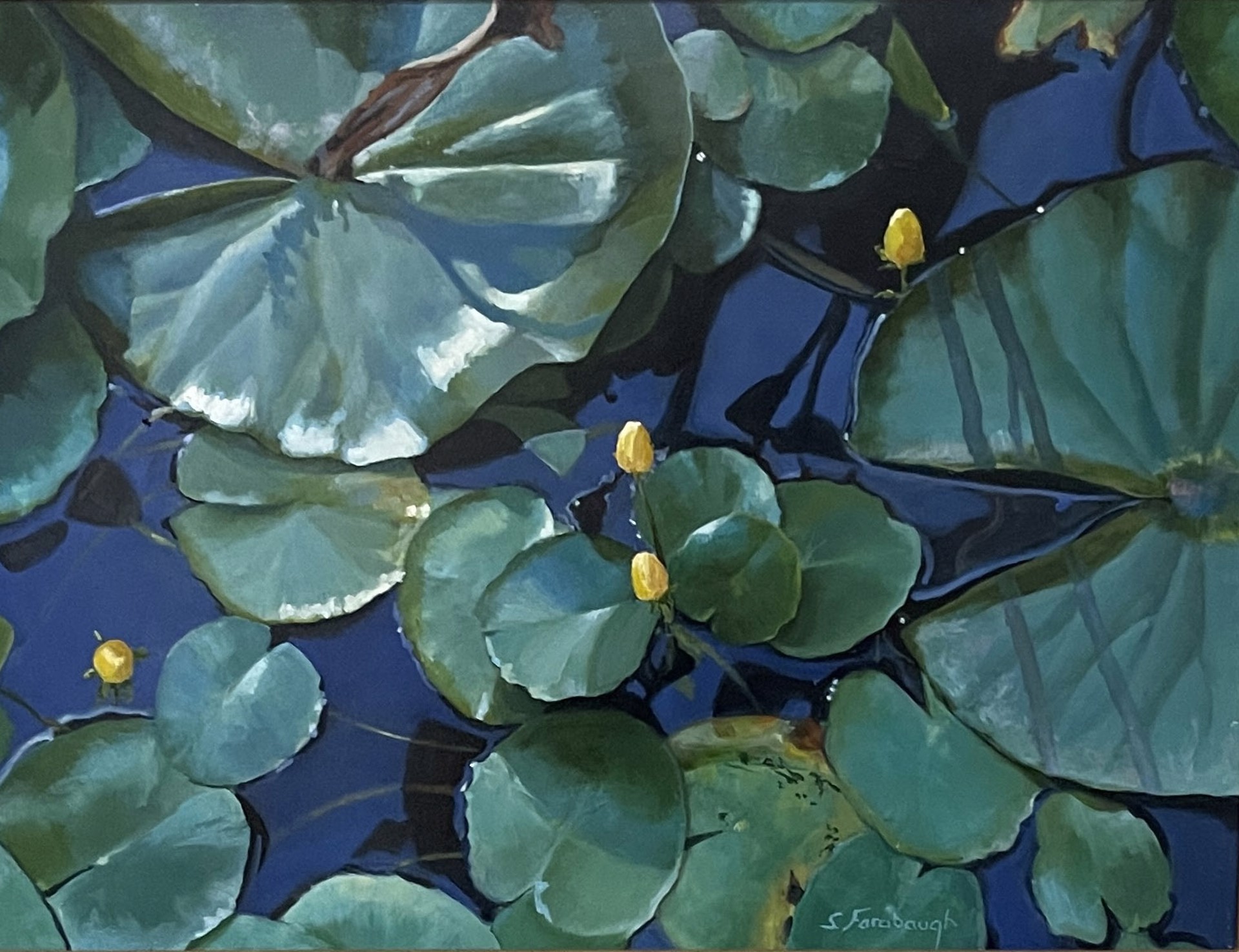 A painting of water lilies in a pond with blue water.