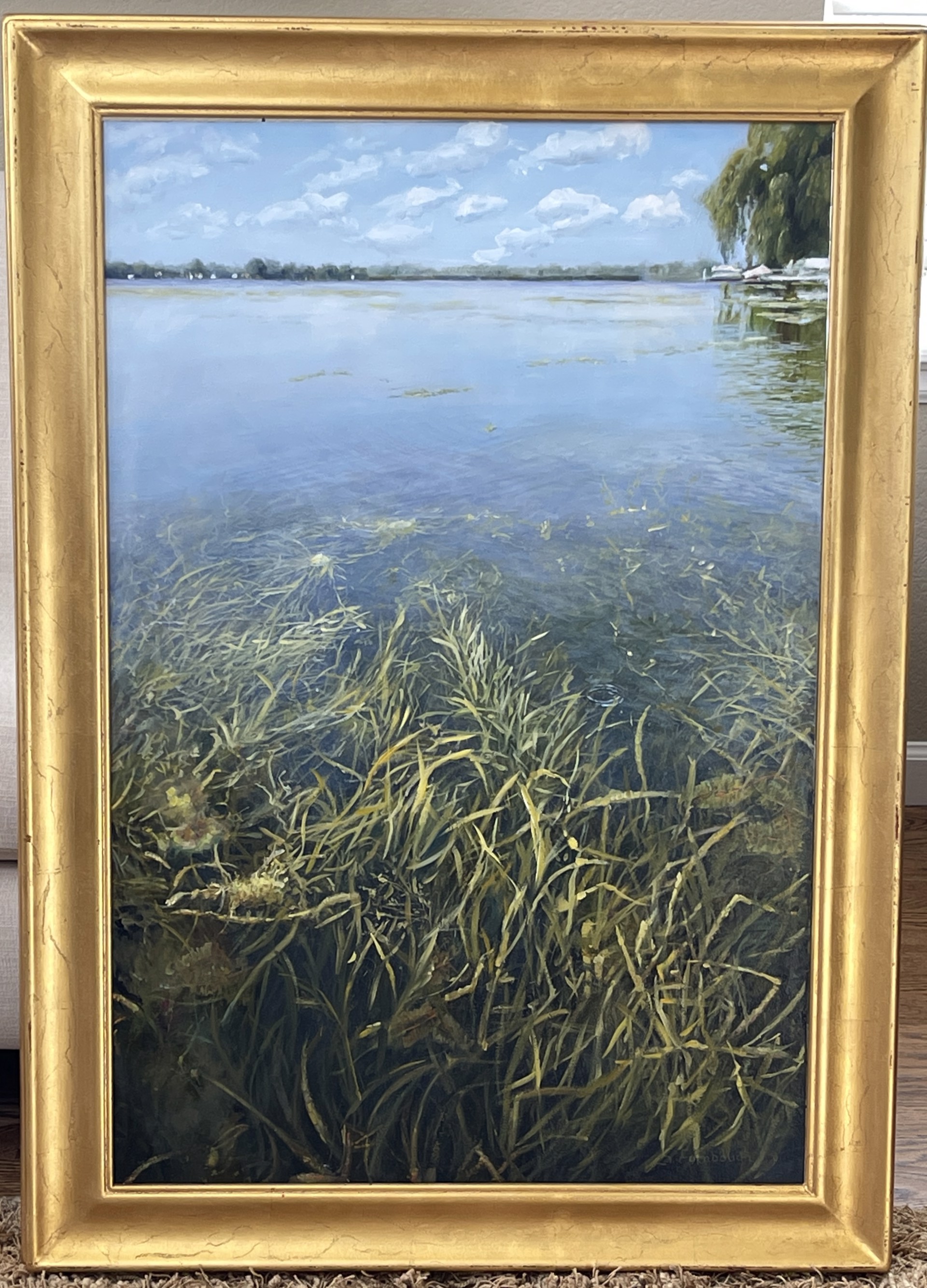 A painting of a body of water surrounded by tall grass.