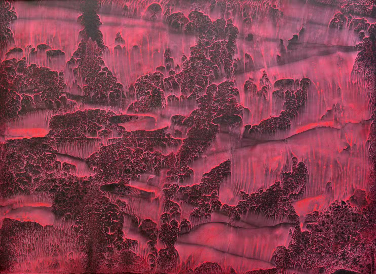 A surreal landscape of dark, textured hills under a glowing red sky.