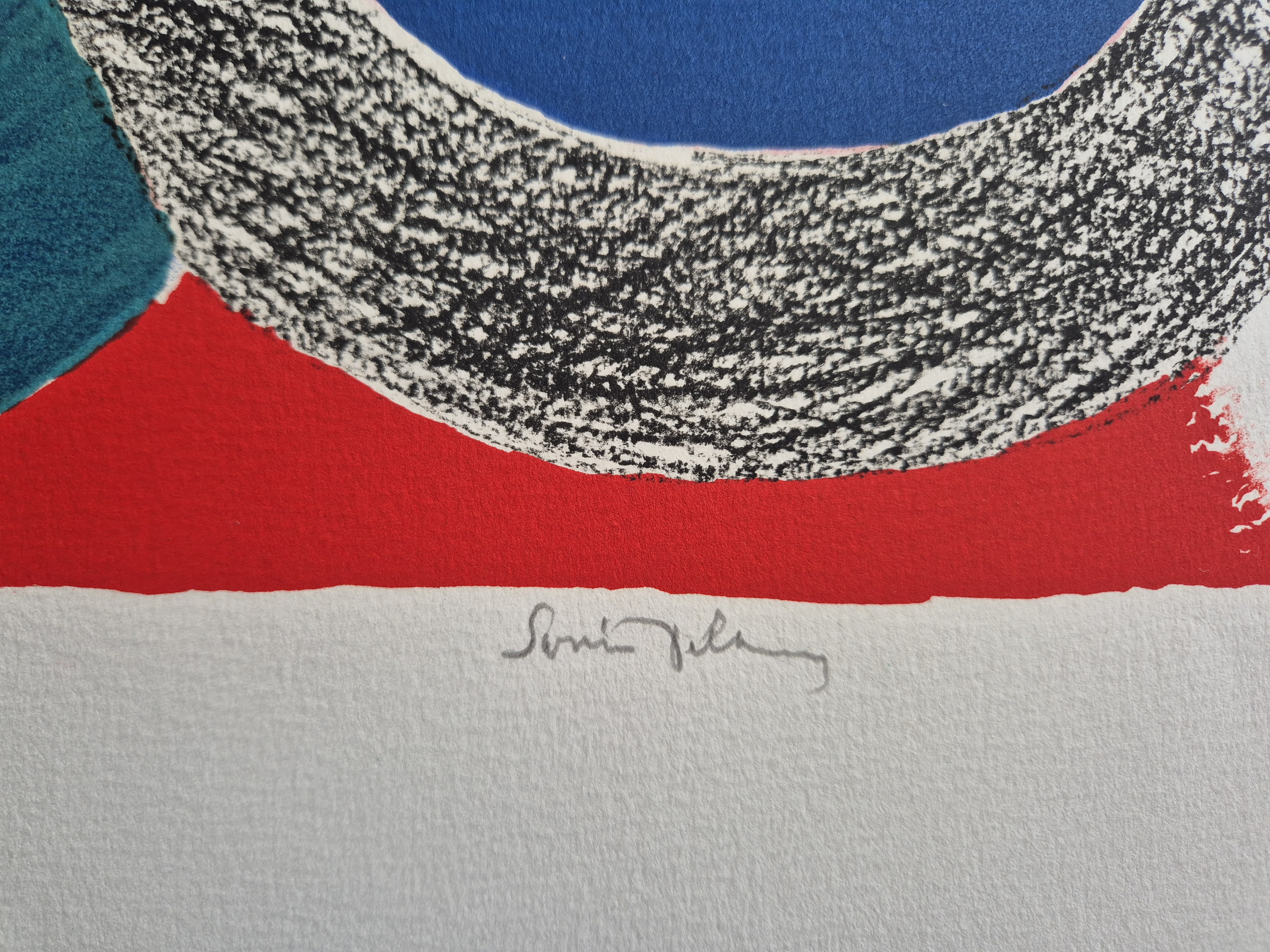 A blue, red, and black abstract painting on a white wall.