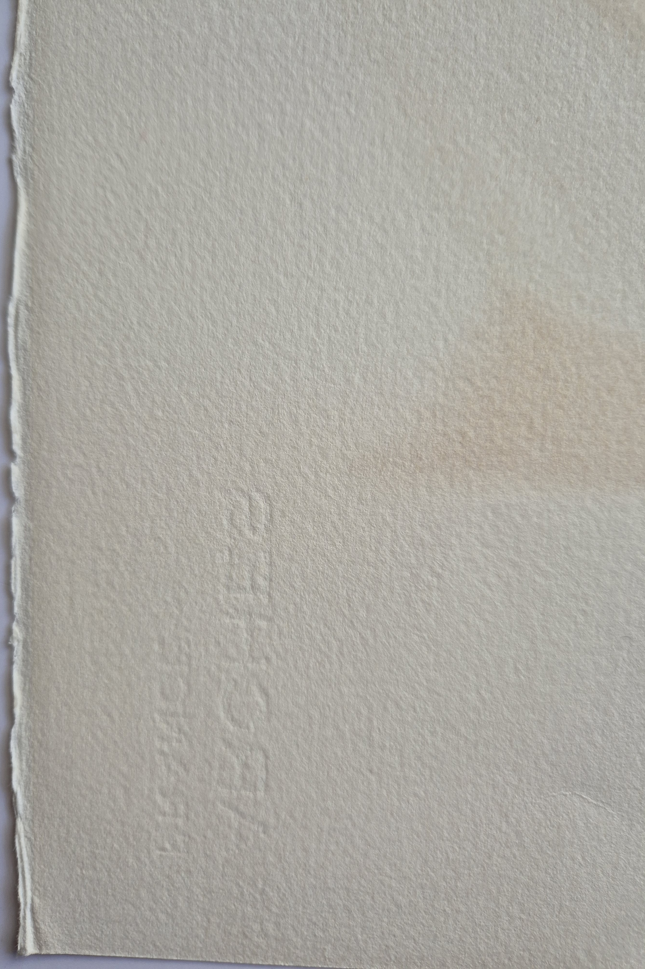 A blue, red, and black abstract painting on a white wall.