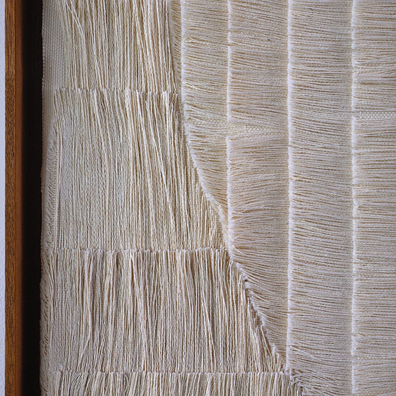 A painting hanging on a wall in a room.