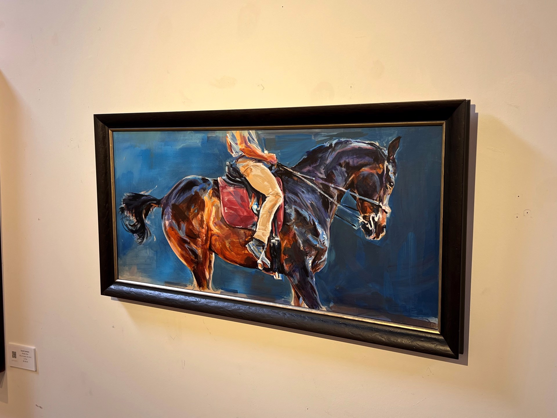 A painting of a person riding a horse.