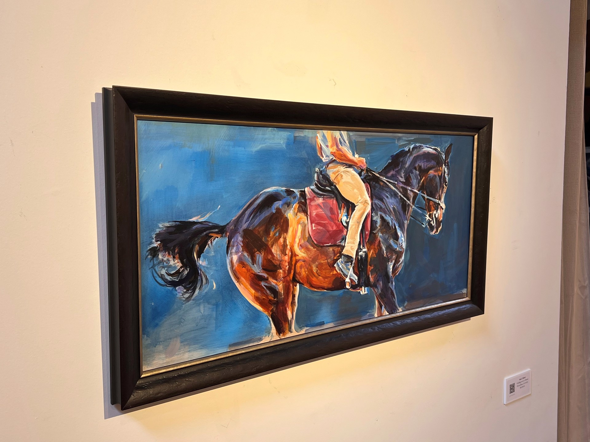 A painting of a person riding a horse.