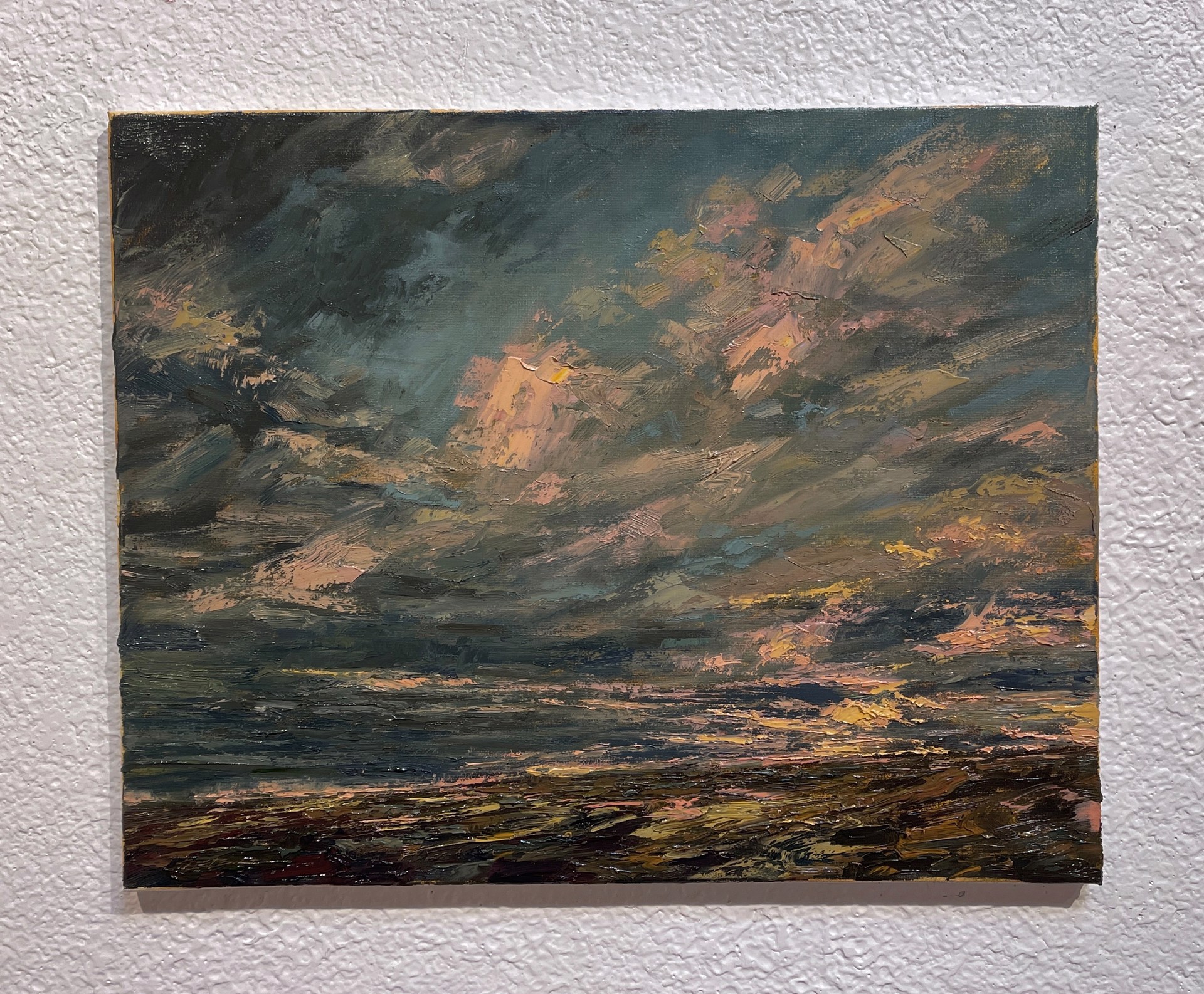 A painting of a cloudy sky over a body of water.
