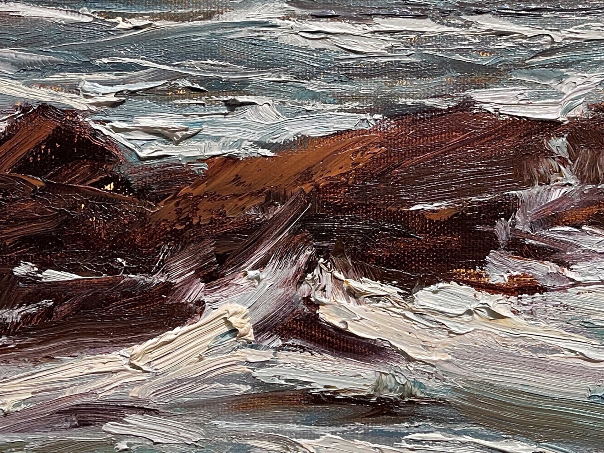 A painting of a rocky shoreline with waves crashing on the rocks.