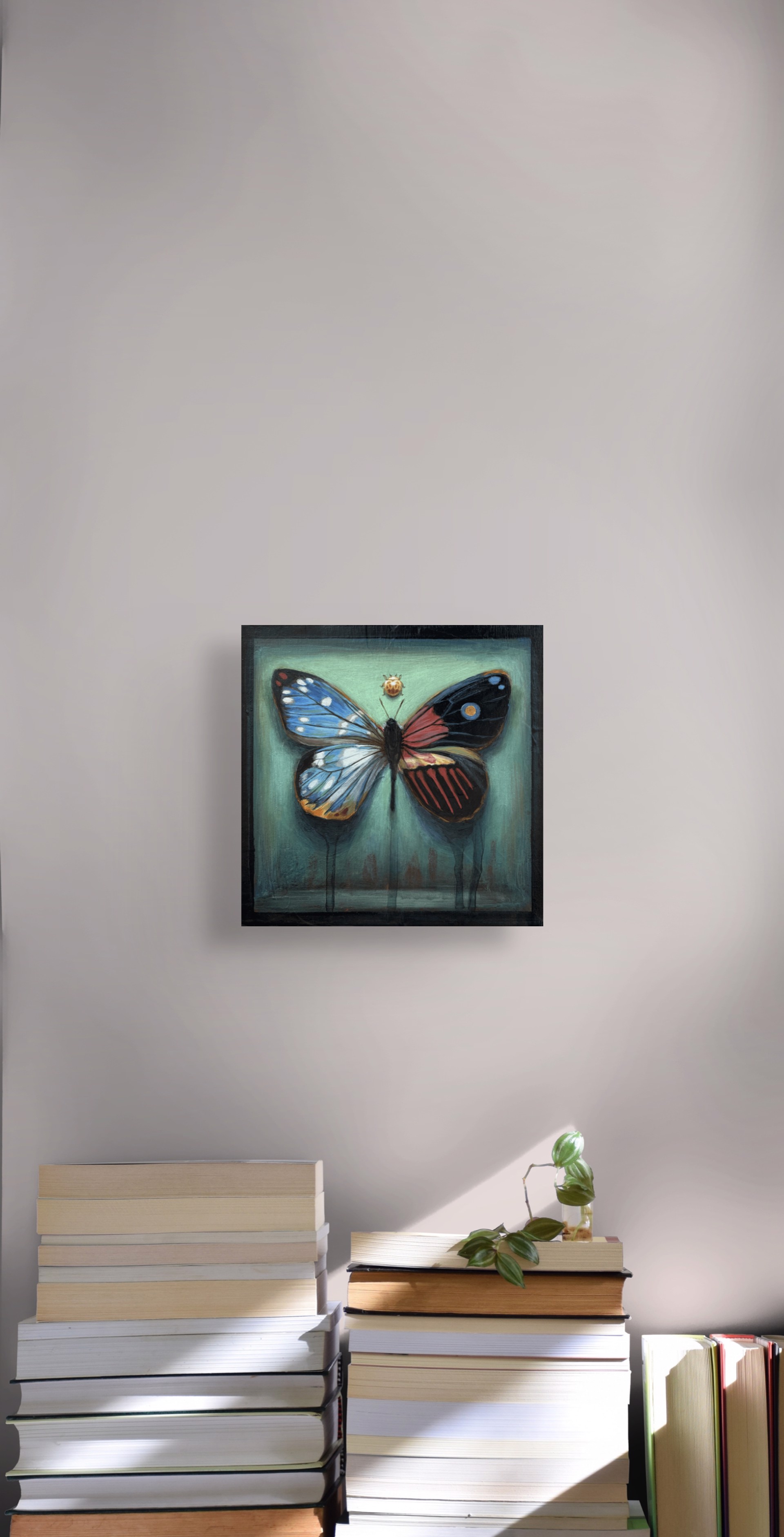 A painting of a butterfly and a ladybug on a green background.