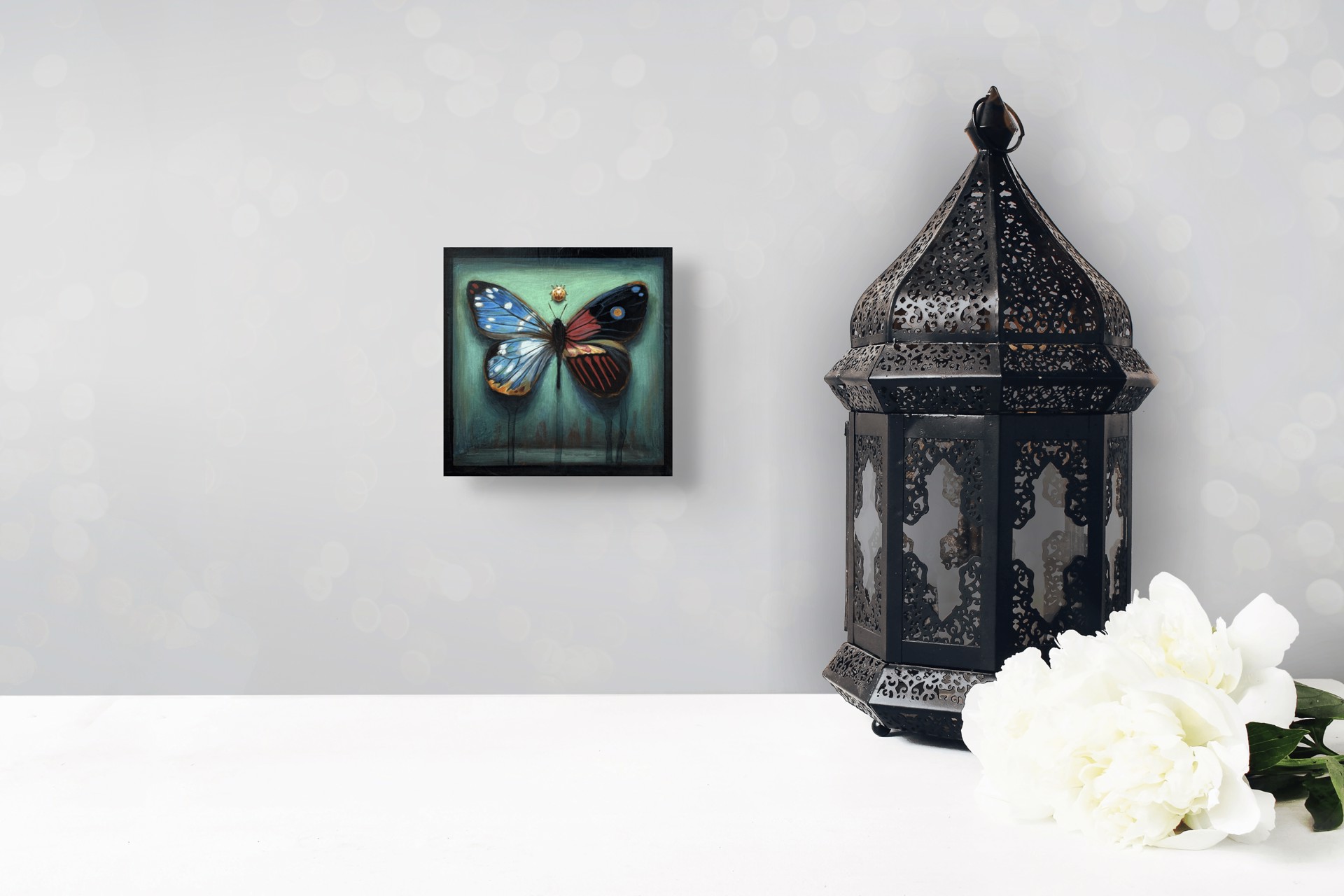 A painting of a butterfly and a ladybug on a green background.