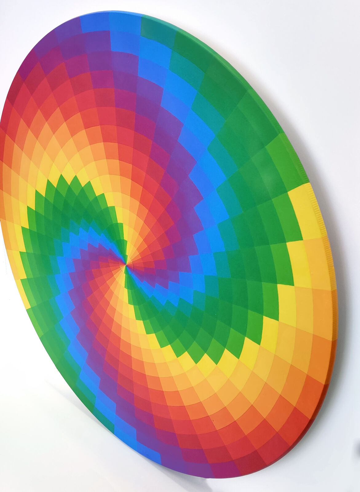 A rainbow colored circle on a white background.