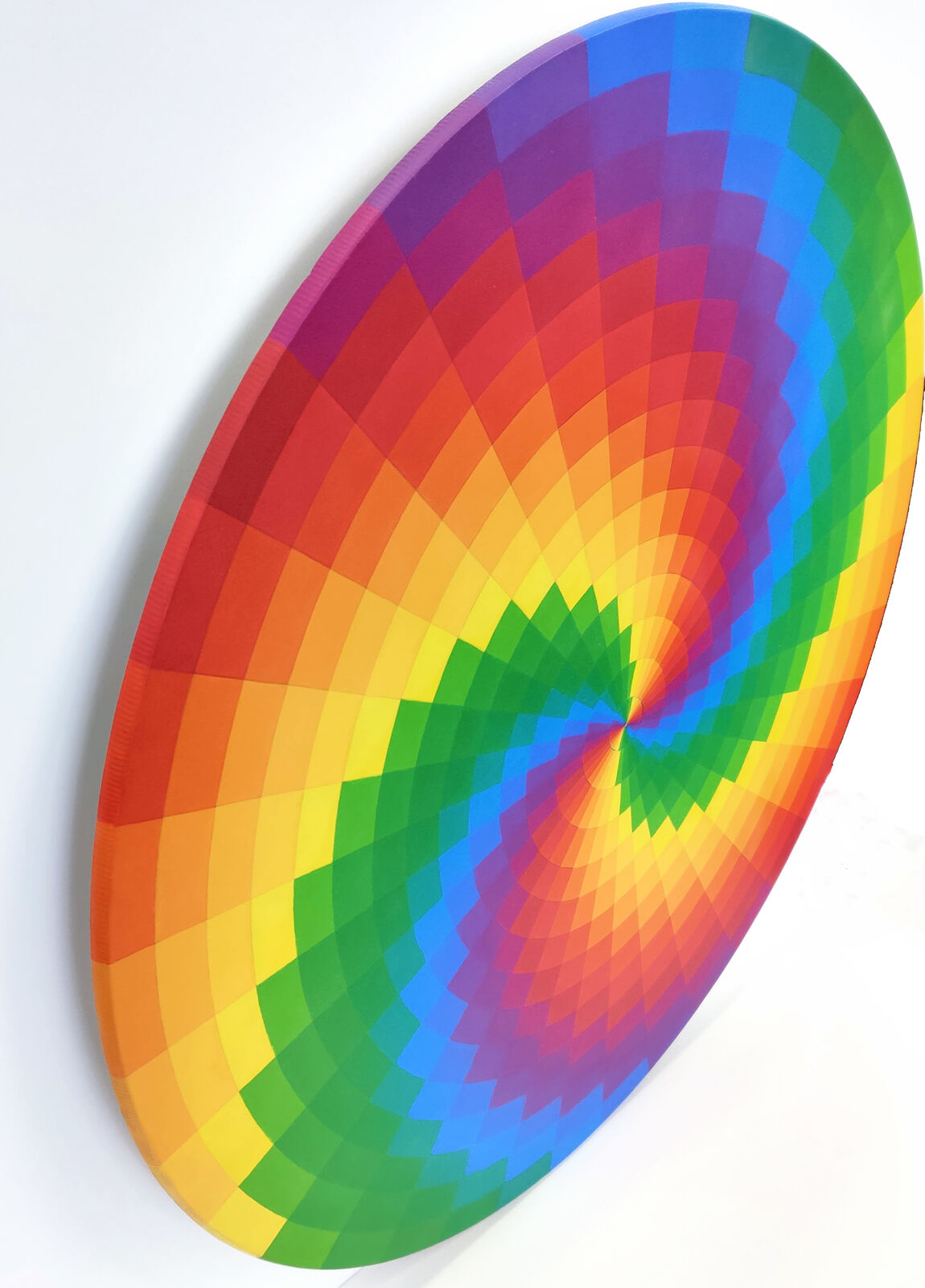 A rainbow colored circle on a white background.