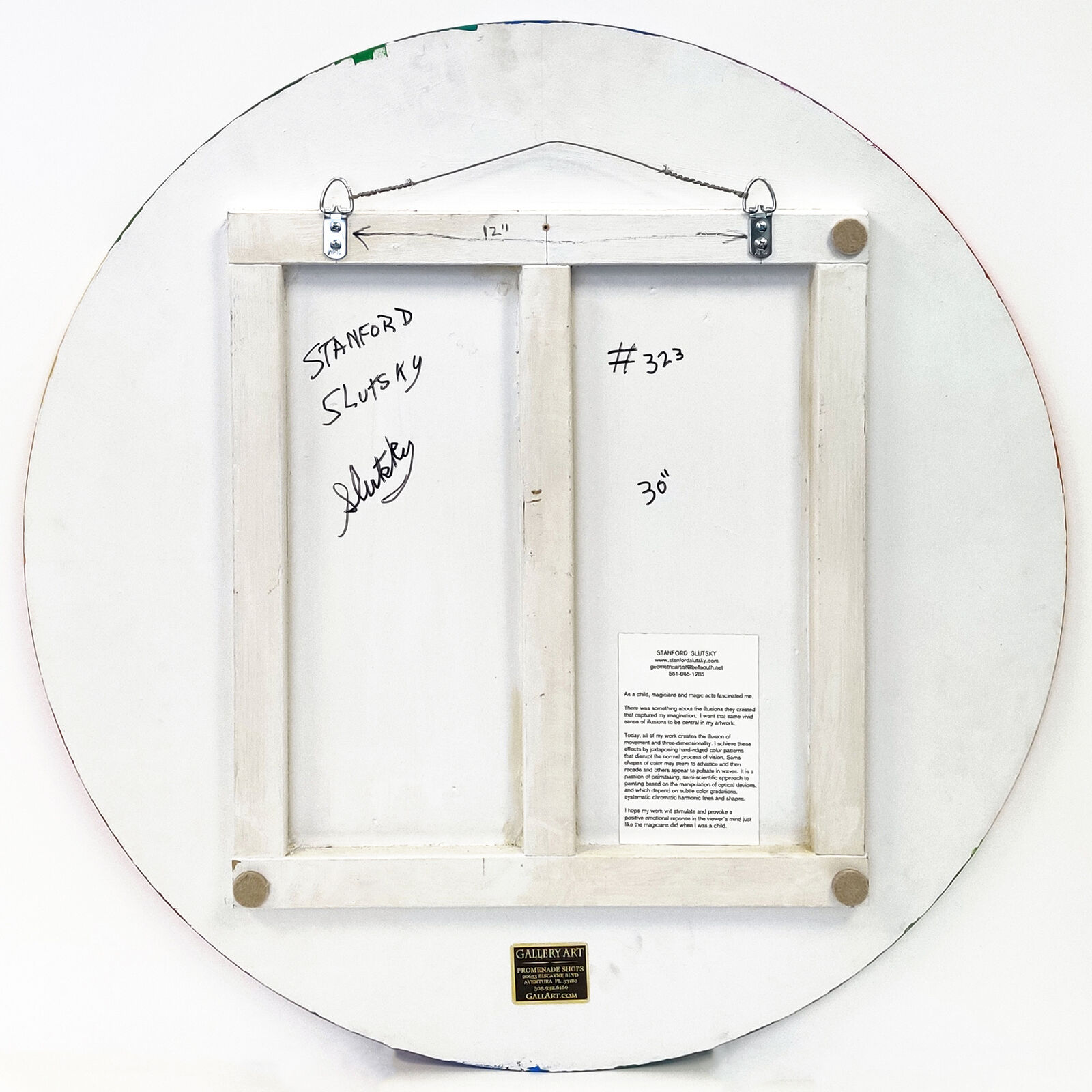 A rainbow colored circle on a white background.