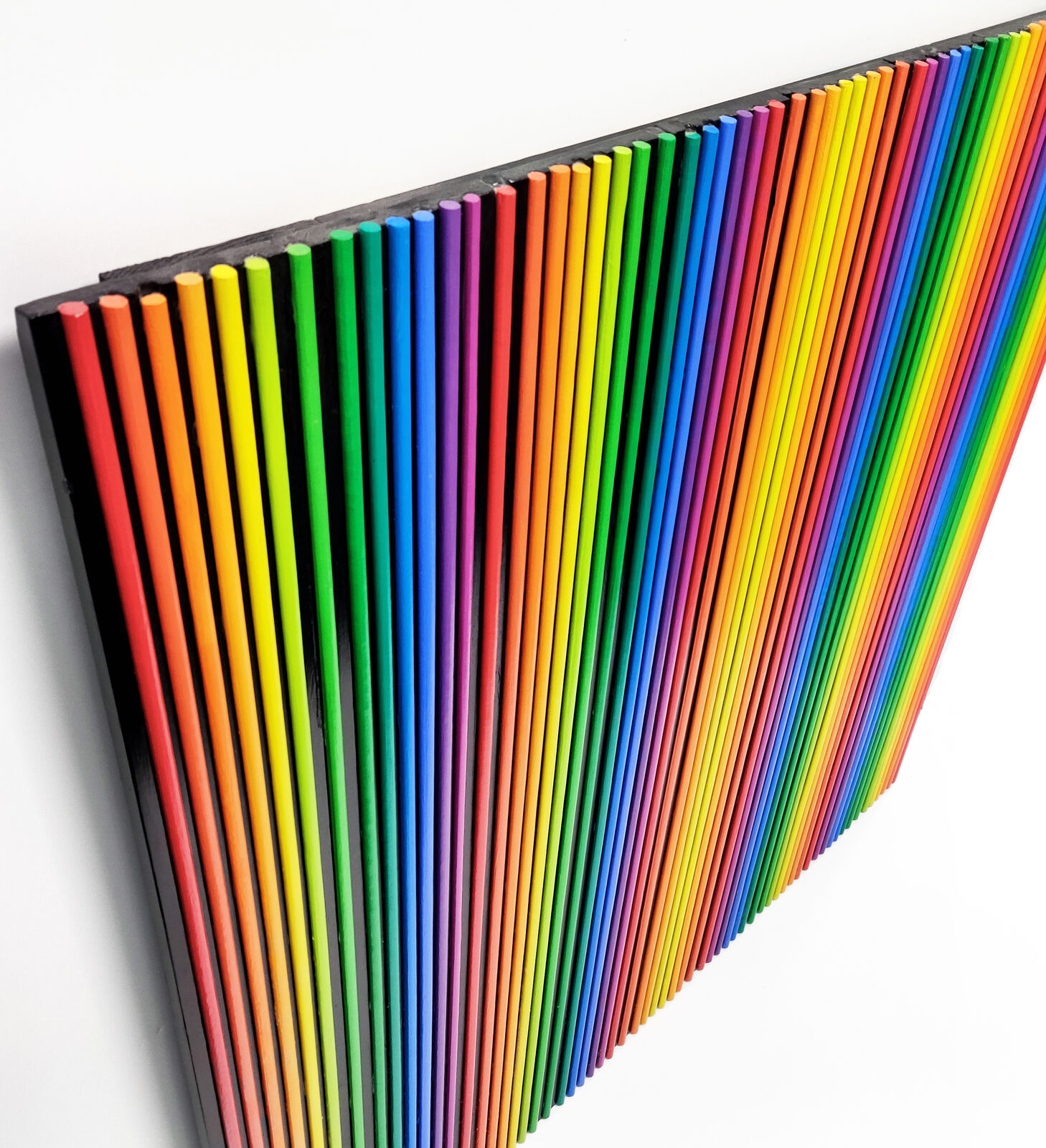 A rainbow colored striped pattern on a white background.