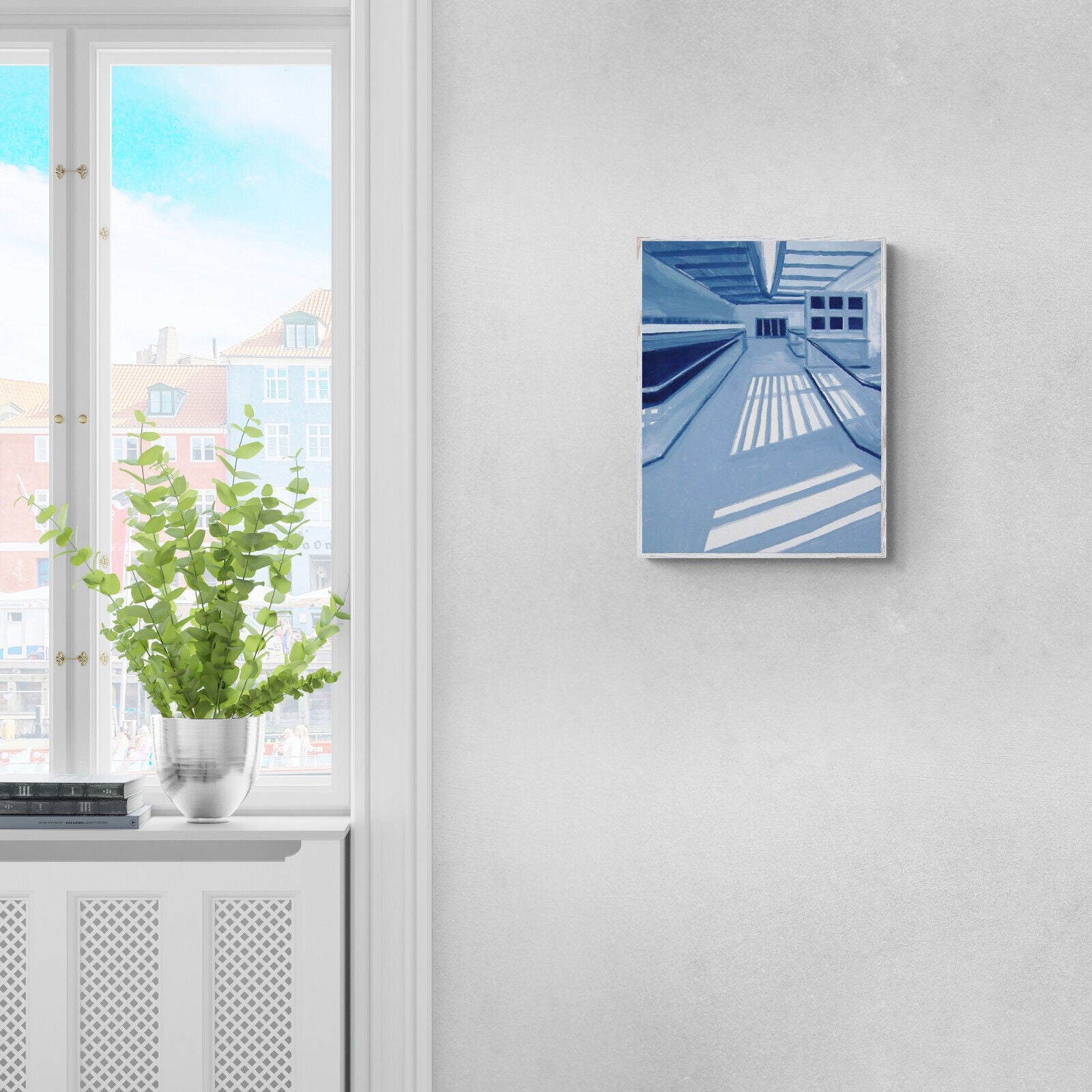 A monochromatic blue interior scene featuring a long corridor with strong geometric shadows.