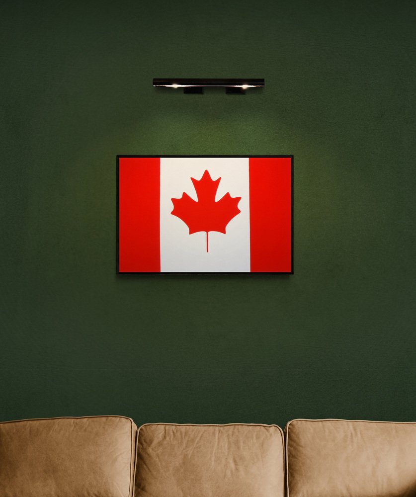 A bold graphic design featuring a red maple leaf centered on a white field flanked by vertical red stripes.