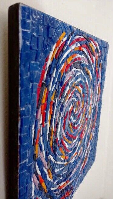 A mesmerizing spiral mosaic artwork featuring vibrant colors and a hypnotic design.