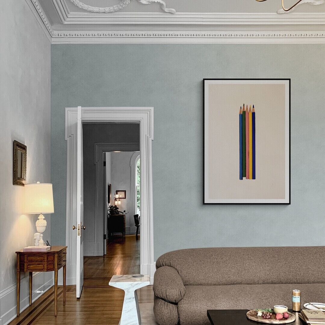 A minimalist print featuring five colored pencils standing vertically against a plain background.