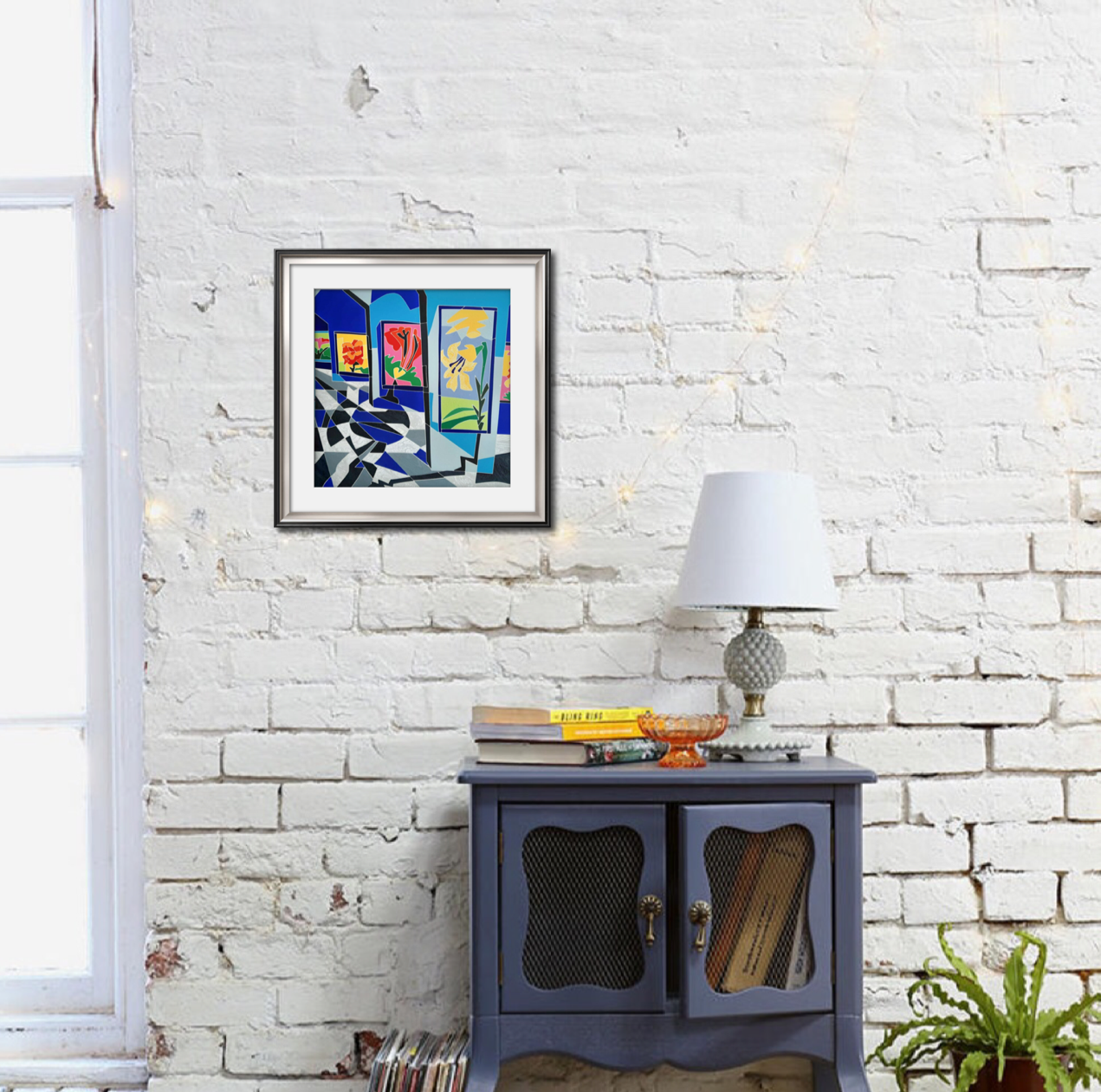 A vibrant geometric composition featuring framed floral paintings displayed on a mosaic-style wall.