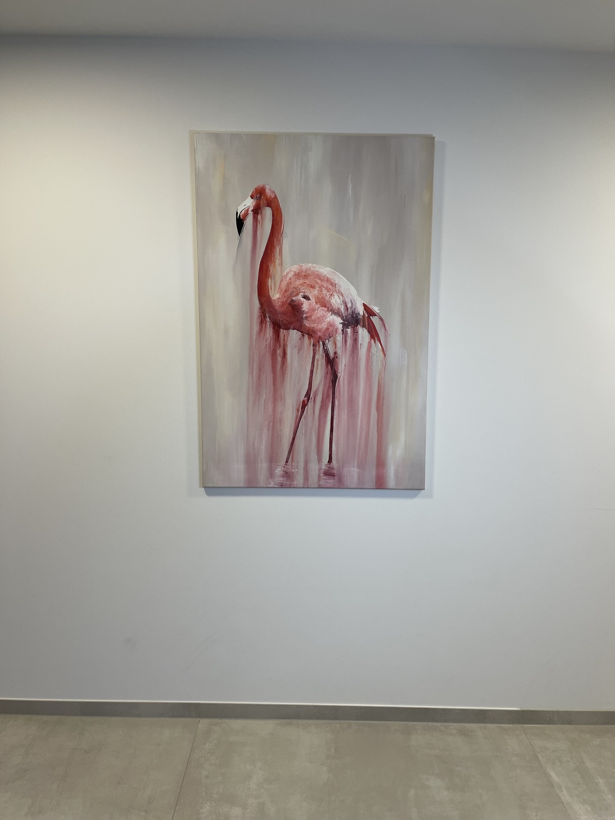 A pink flamingo stands in a dreamy, dripping watercolor style against a soft background.