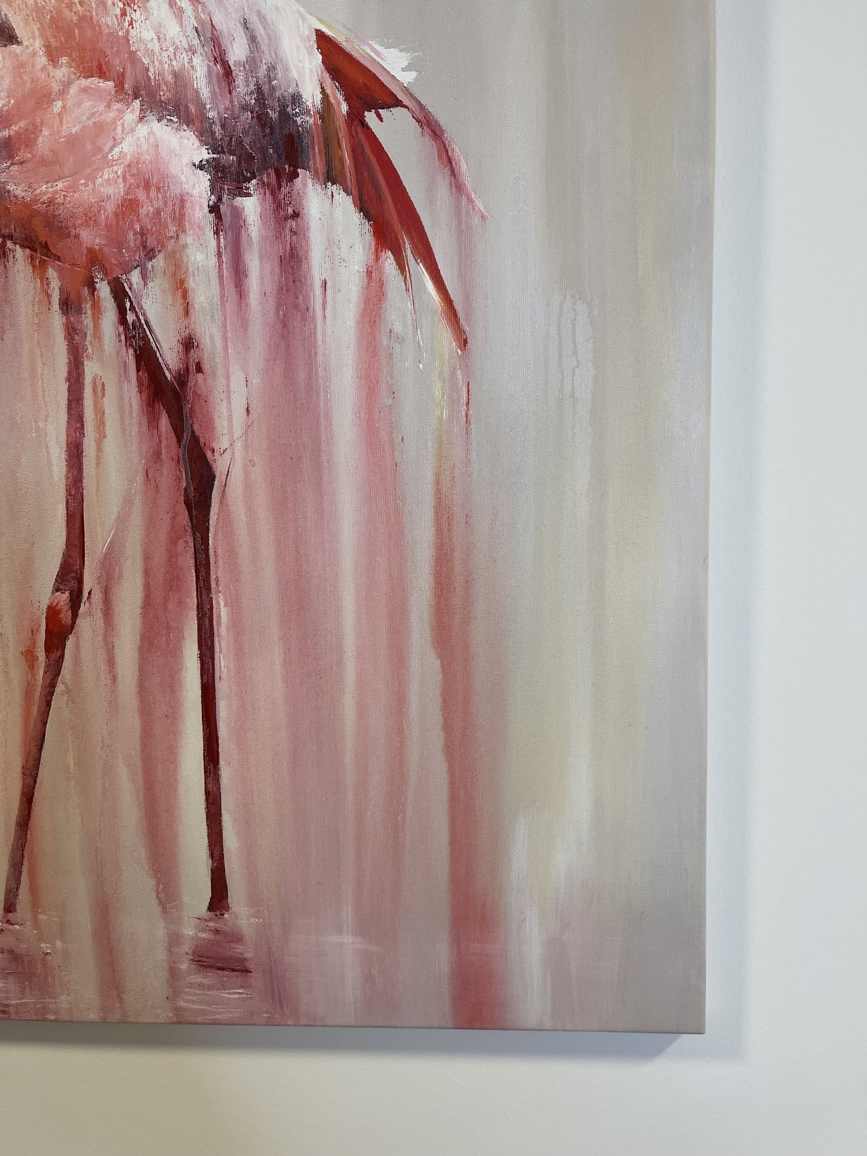 A pink flamingo stands in a dreamy, dripping watercolor style against a soft background.