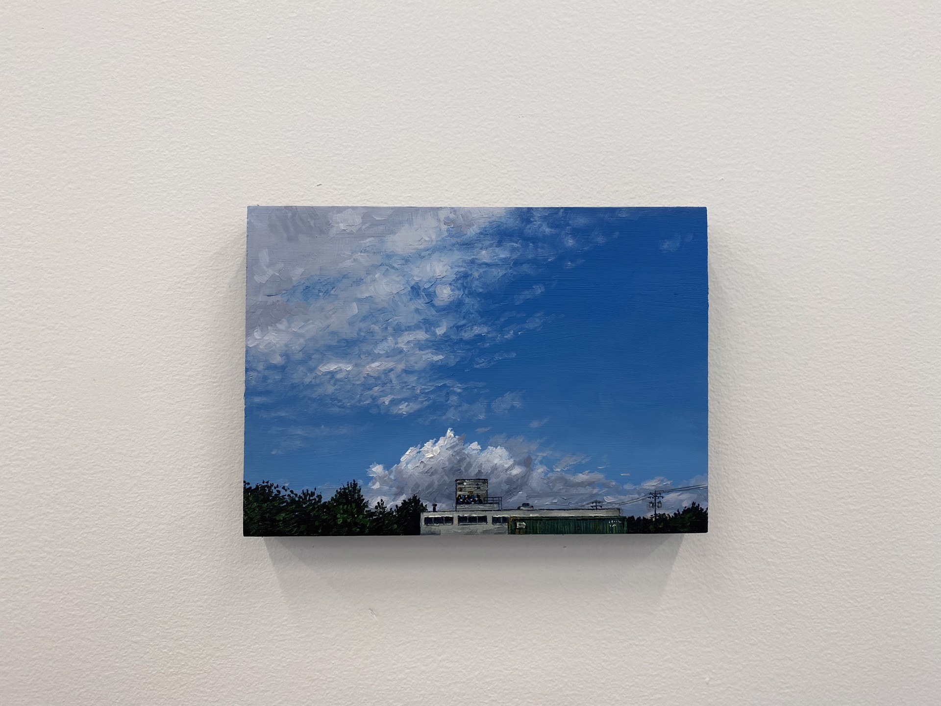 A painting of a building with a cloudy sky in the background.