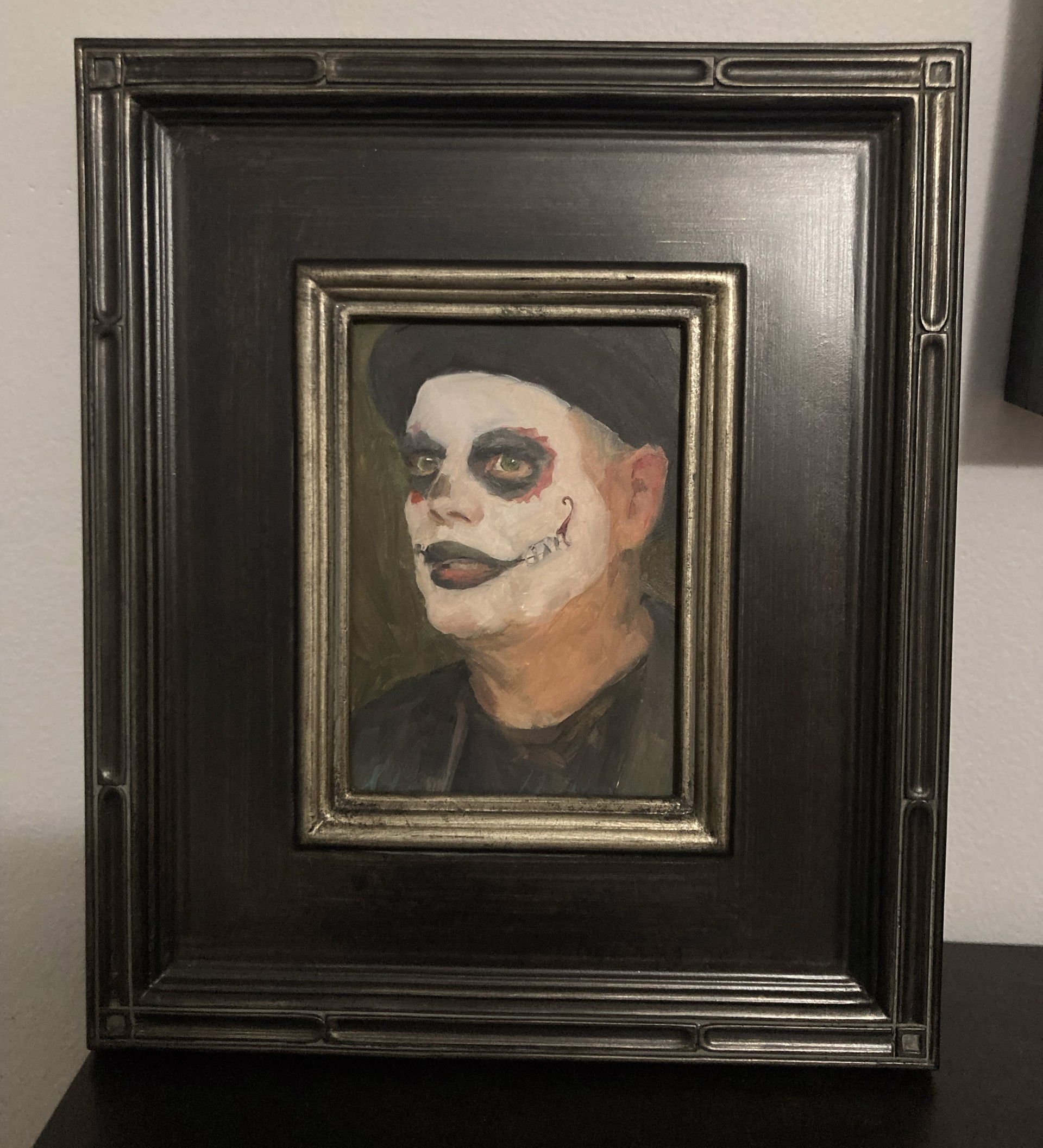 A portrait of a figure in white face paint with a black hat, rendered in an expressive oil painting style.