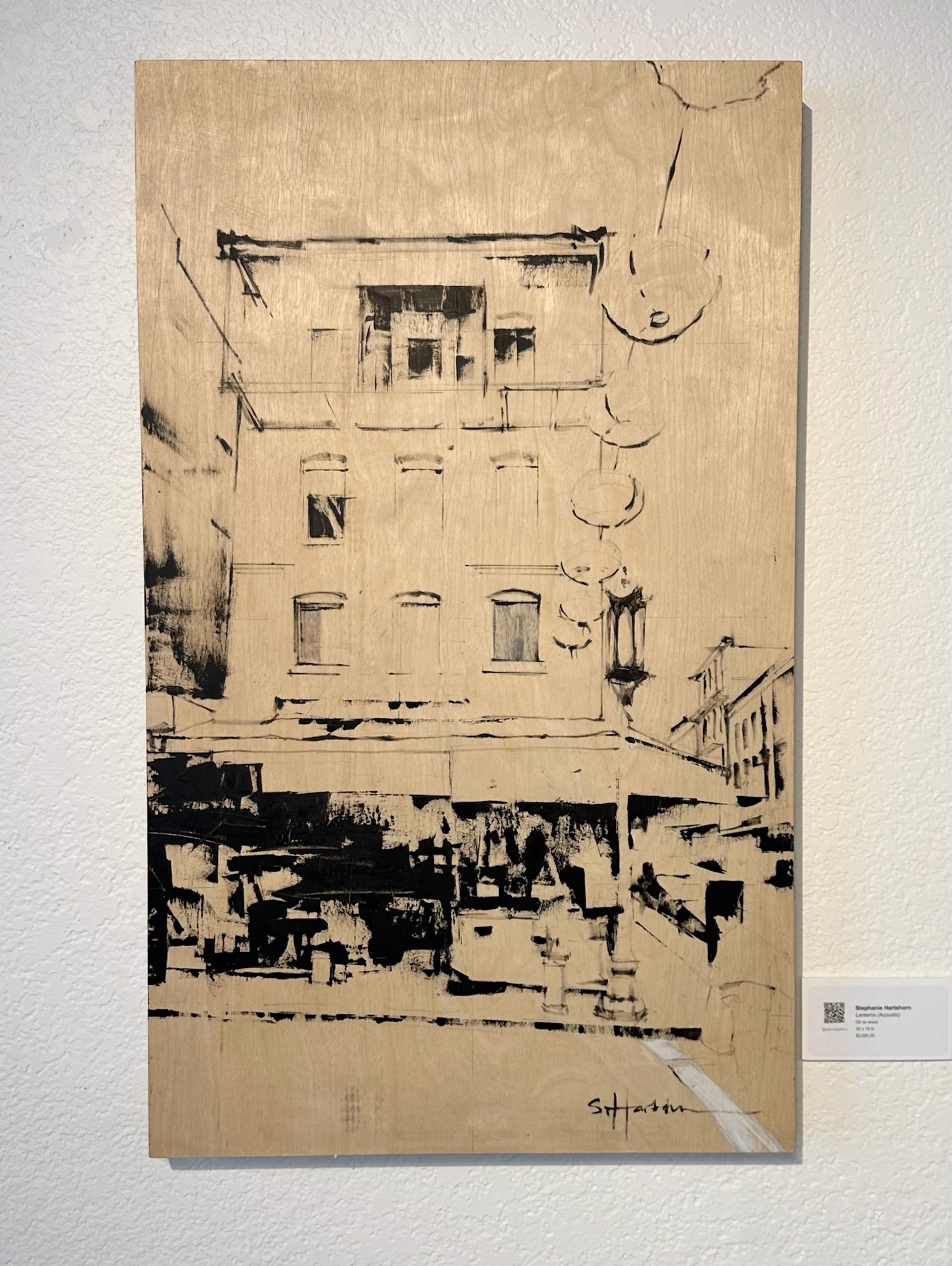 A monochromatic sketch of a street corner with a multi-story building and hanging lanterns.