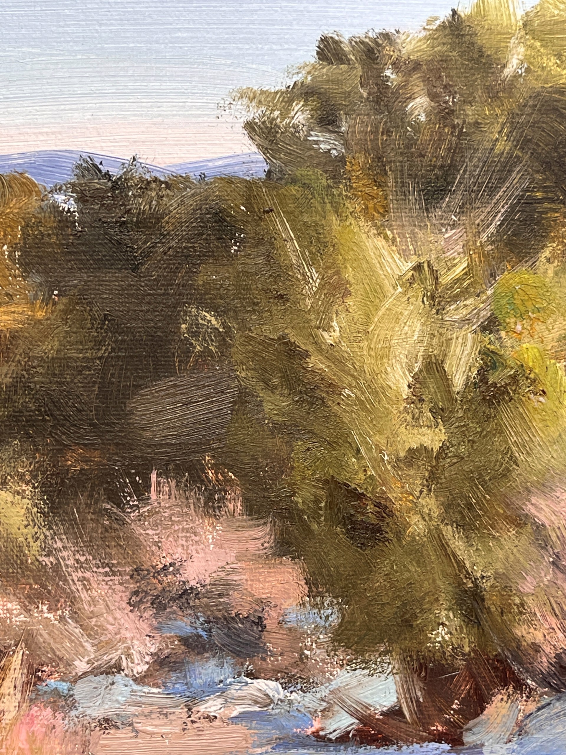 A painting of a snowy landscape with trees in the background.