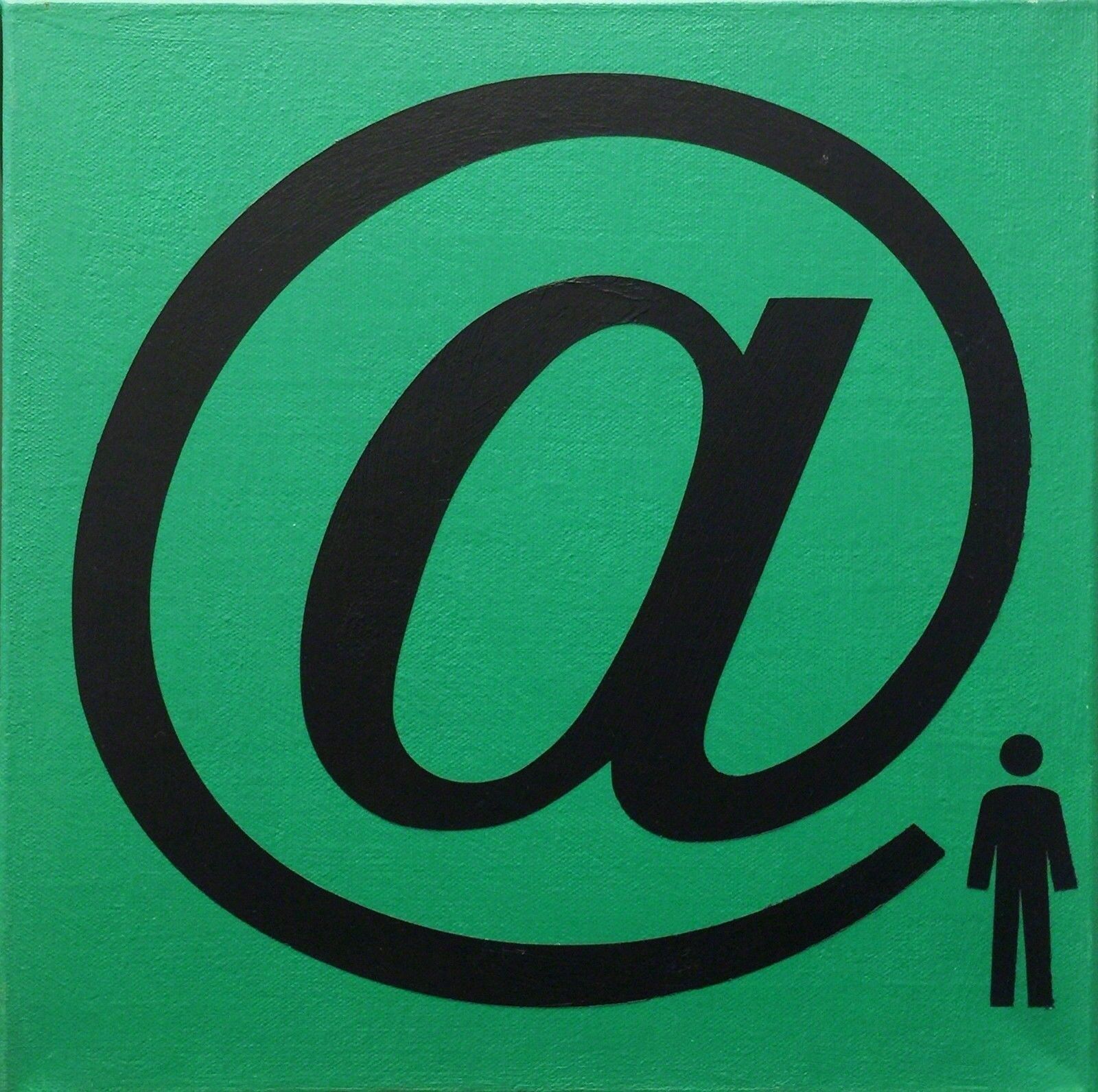 A green and black sign with an at symbol on it.
