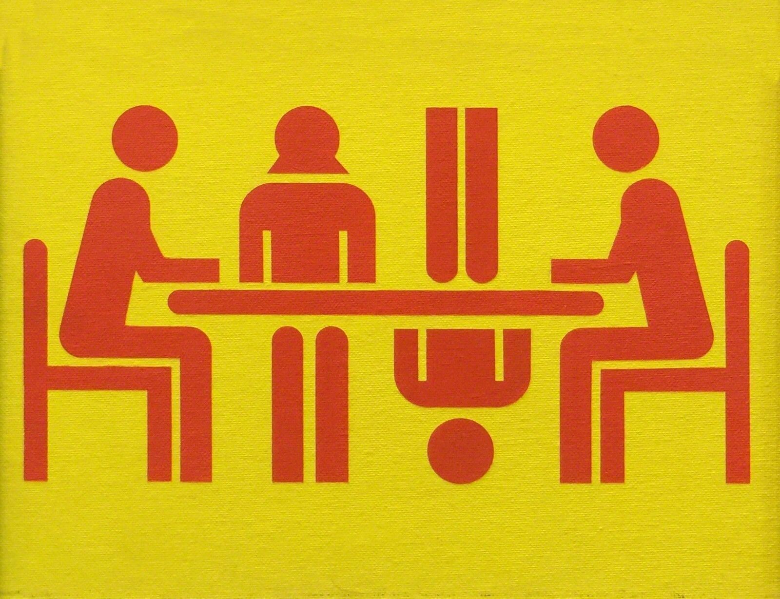 A picture of three people sitting at a table in a box.