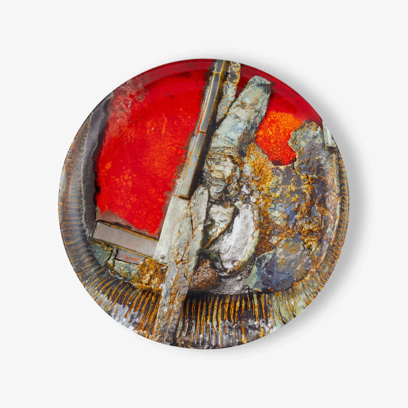 A plate with a red and gold design on it.