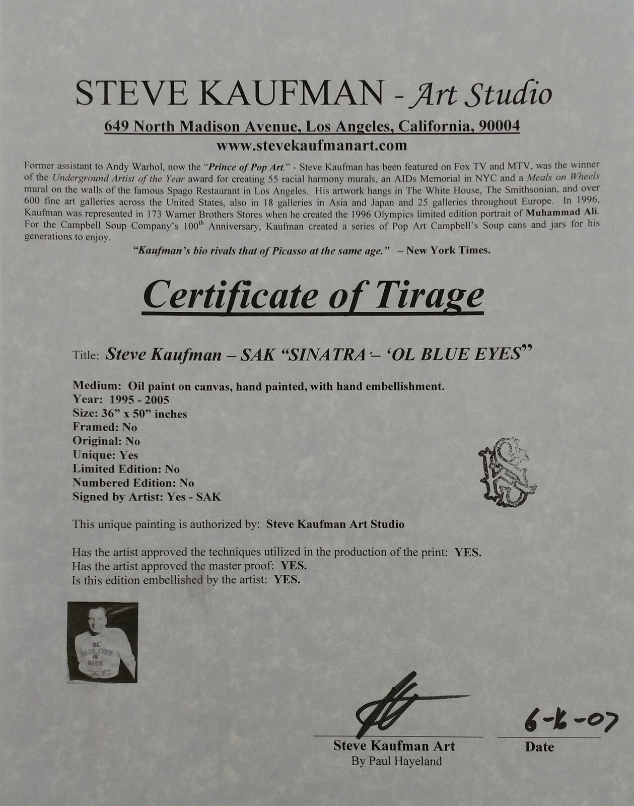 A black and white photo of a man wearing a sweatshirt that says "Ol' Blue Eyes is Back."