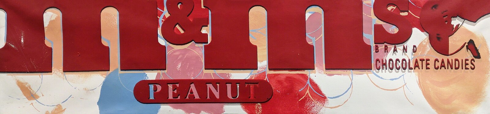 A close-up of a candy package featuring bold red typography and abstract watercolor-style splashes.
