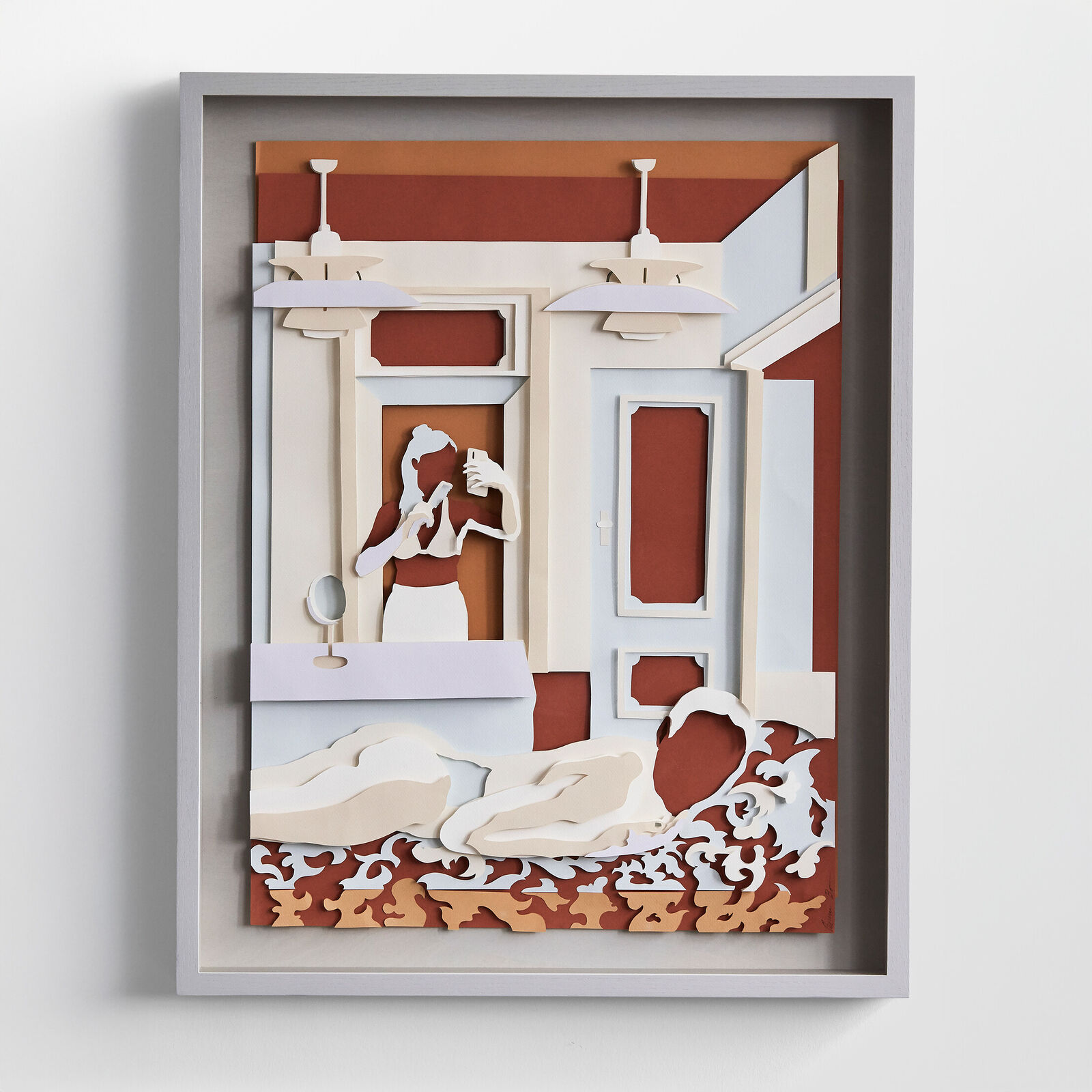 A paper cut of a woman in a bathroom.