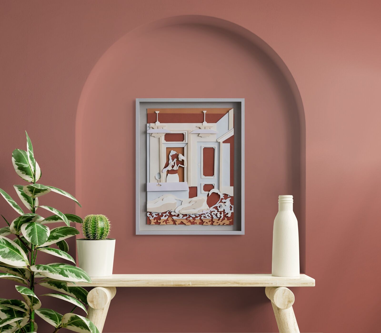 A paper cut of a woman in a bathroom.