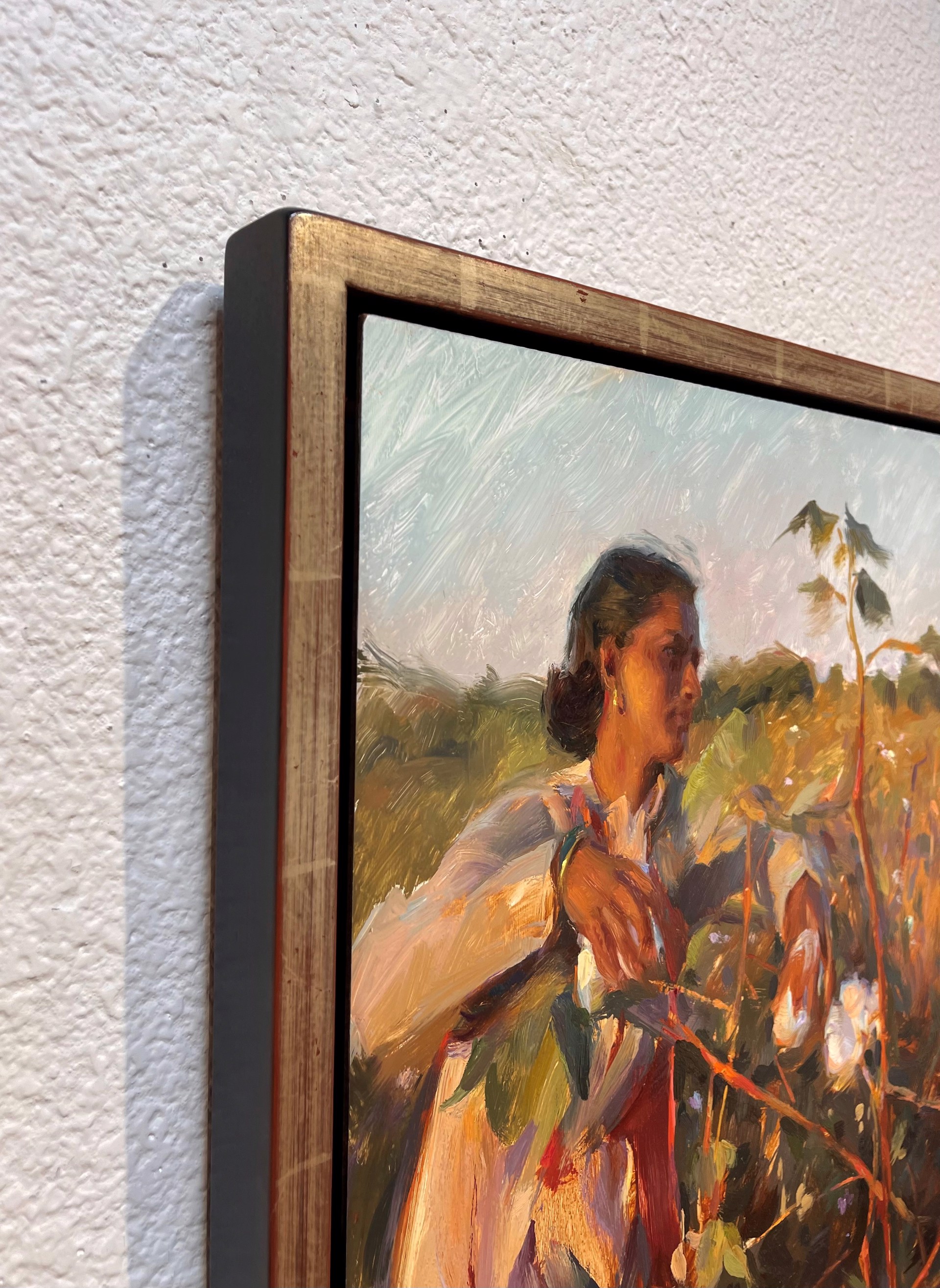 A painterly portrait of a person in a field, reaching for cotton.