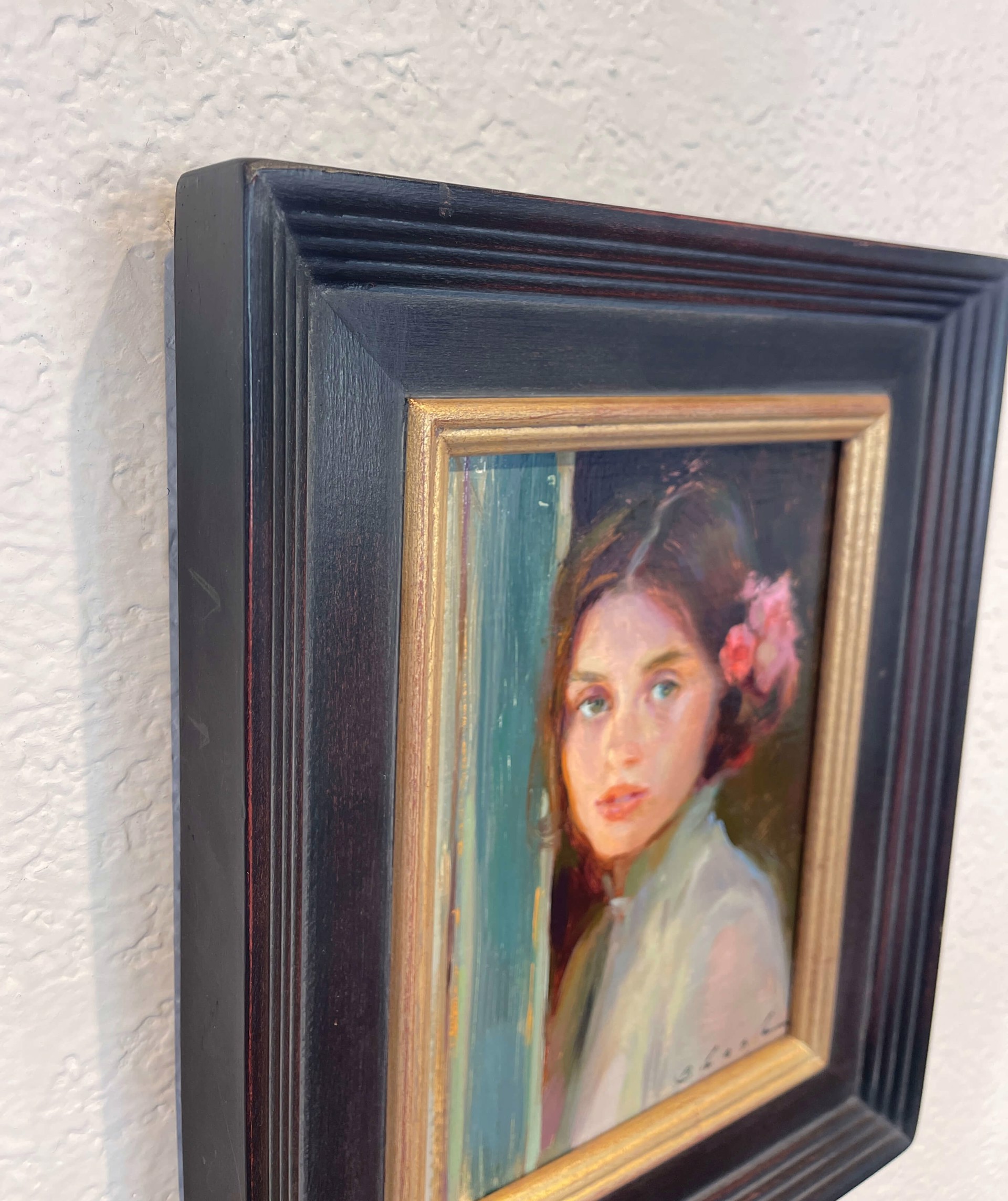 A painting of a woman with a flower in her hair.