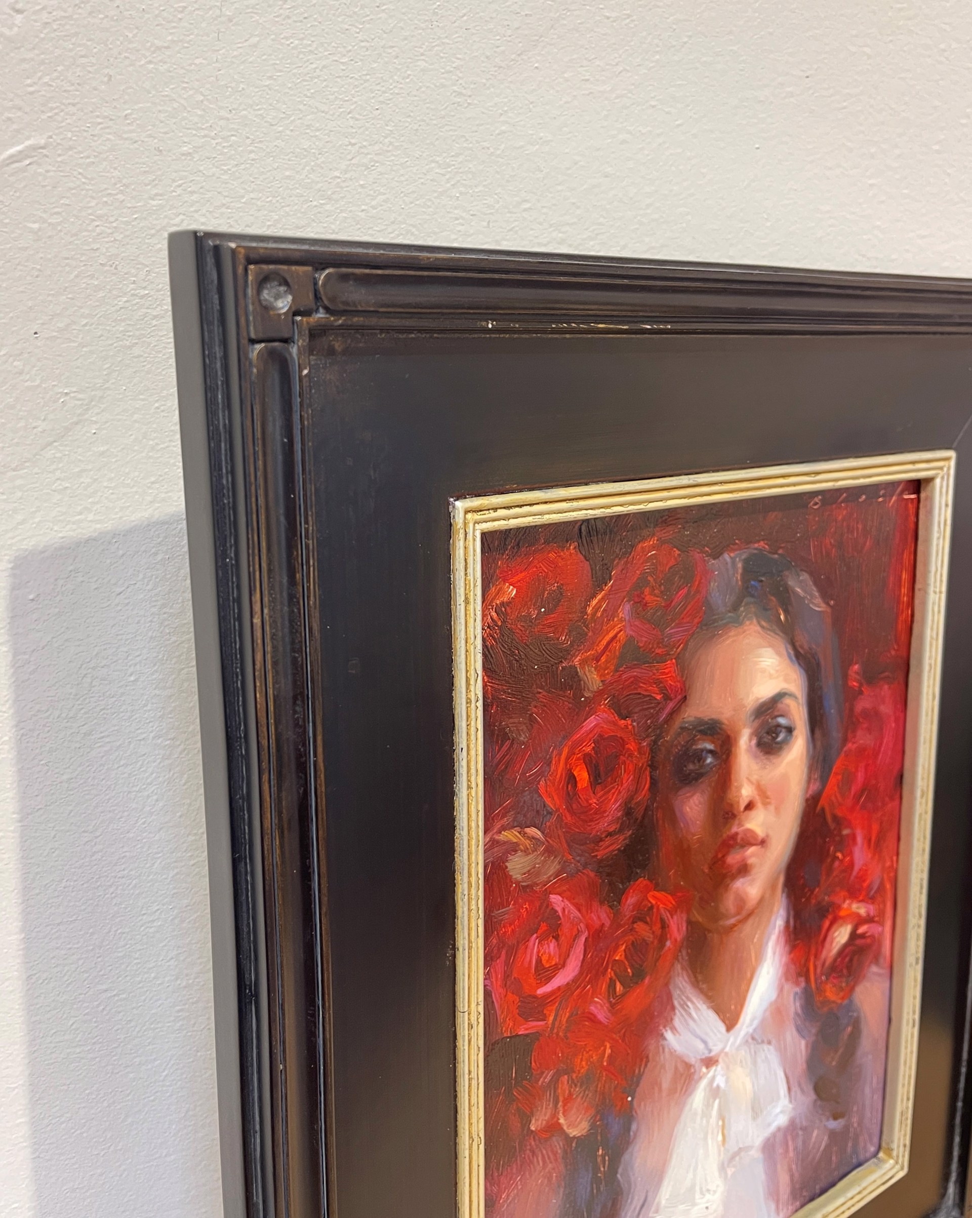 A painting of a woman with red roses in her hair.