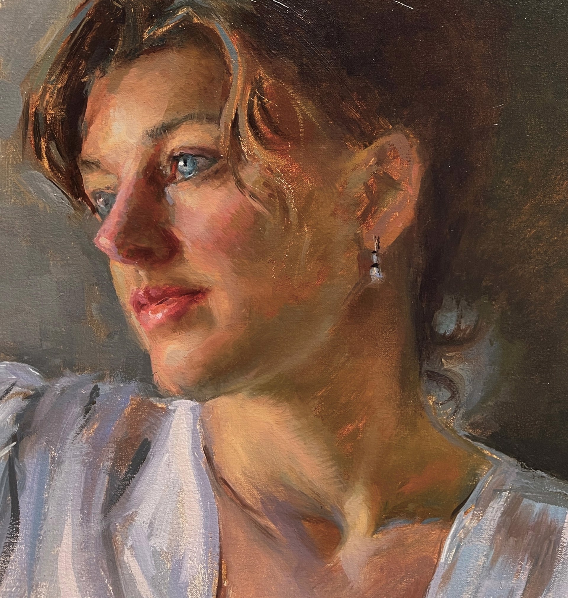 A soft-focus portrait of a person in a white blouse, rendered with loose brushwork and warm lighting.